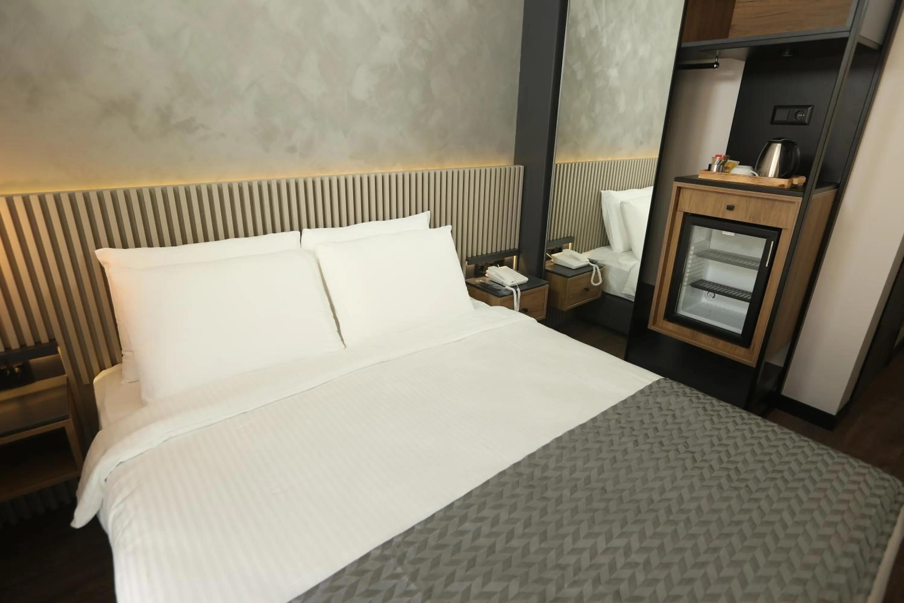 Bed in Moja City Hotel