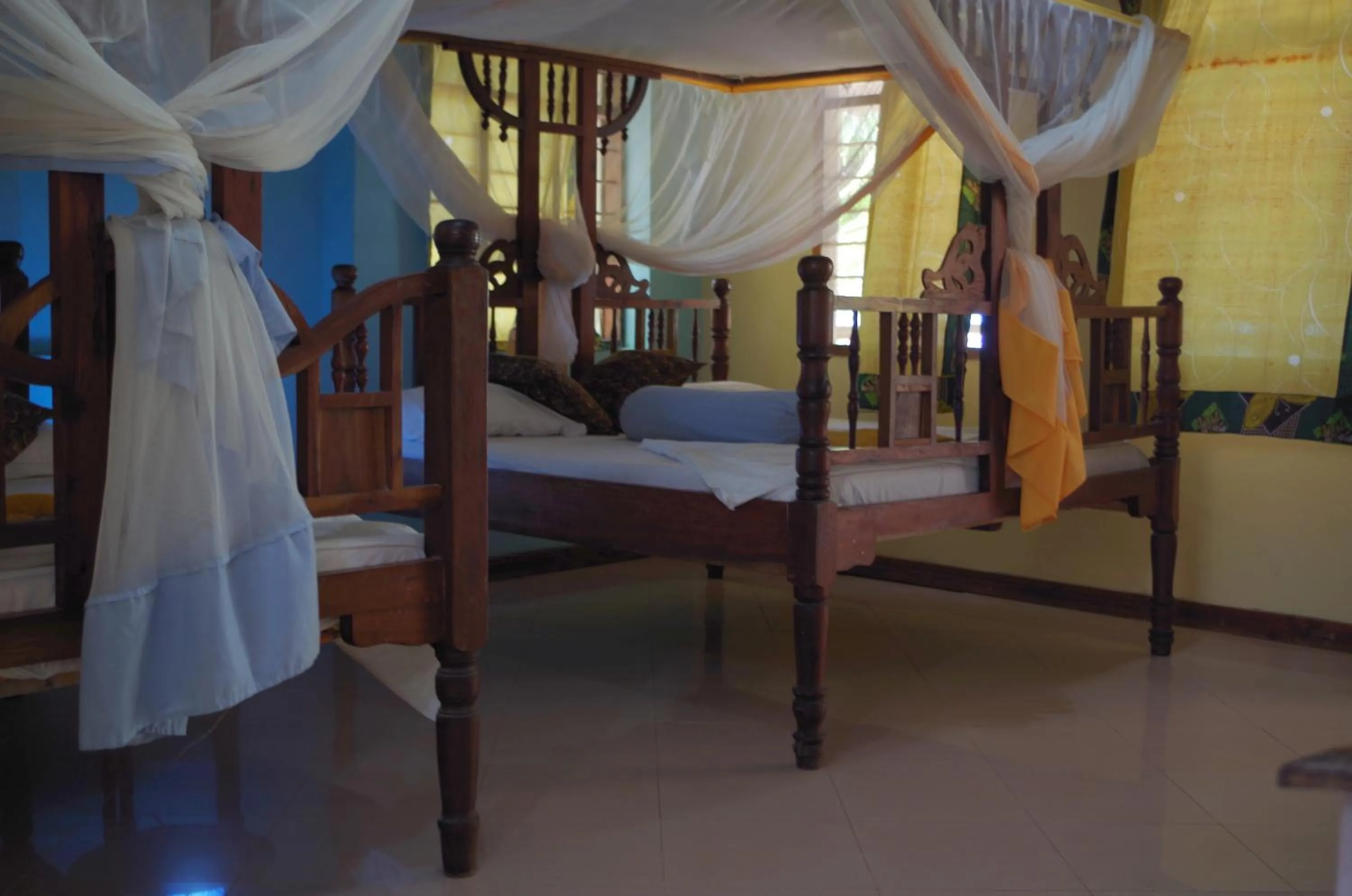 Pool view, Bed in Mbuyuni Beach Village