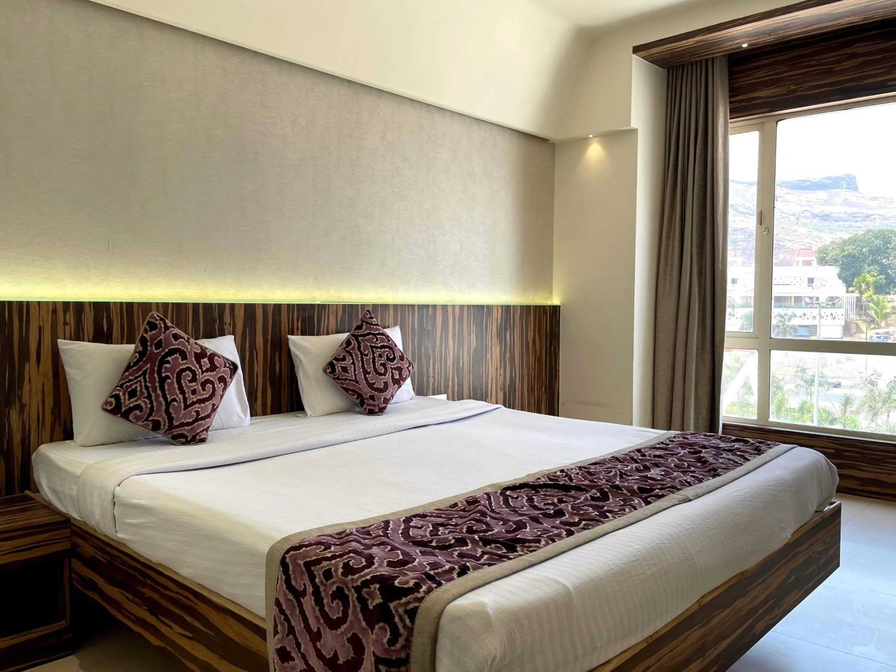 View (from property/room), Bed in Hotel Grand Parivaar