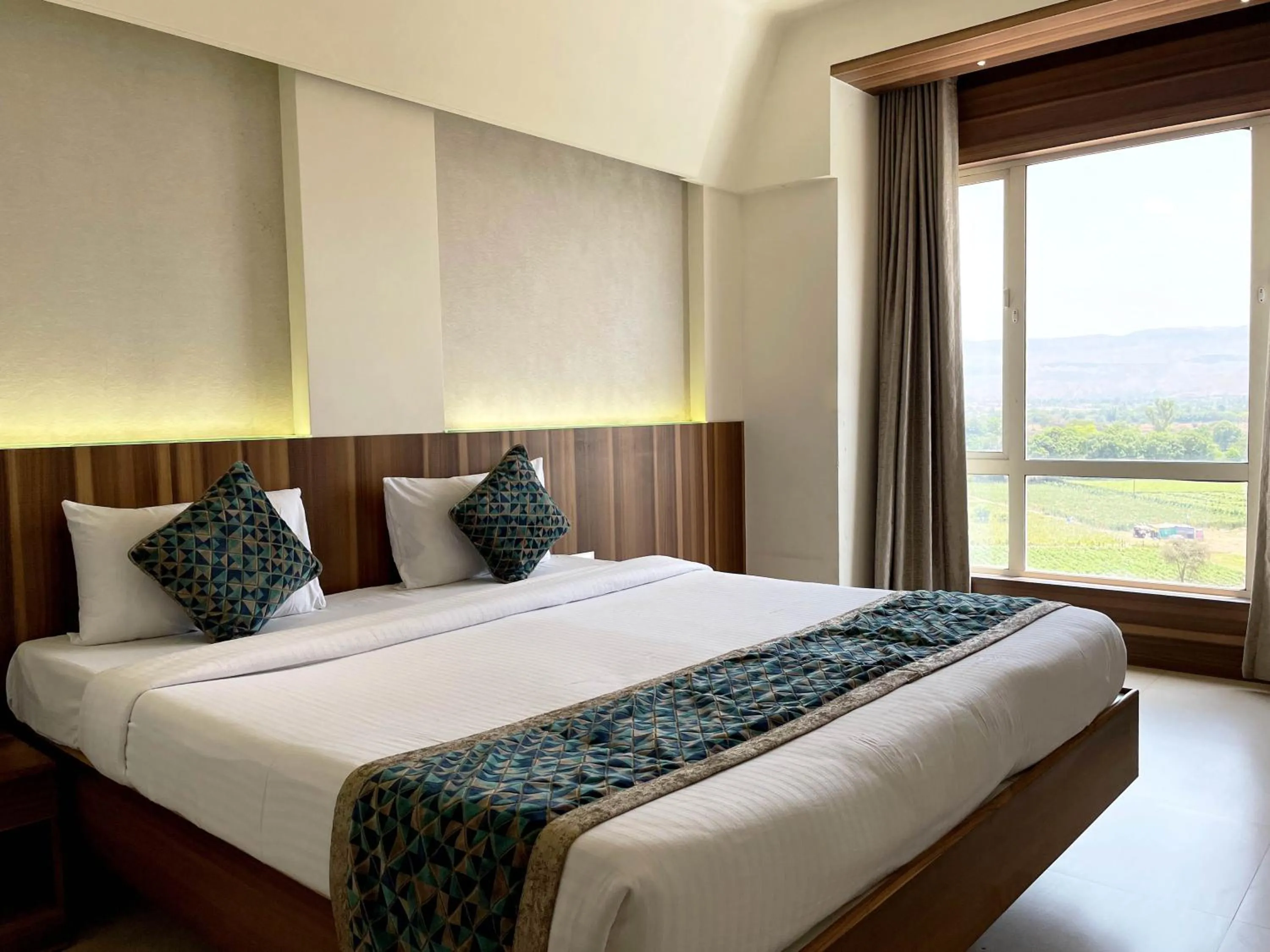 View (from property/room), Bed in Hotel Grand Parivaar