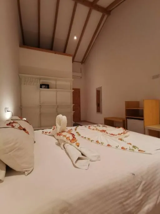 Bed in Origami Inn Himandhoo