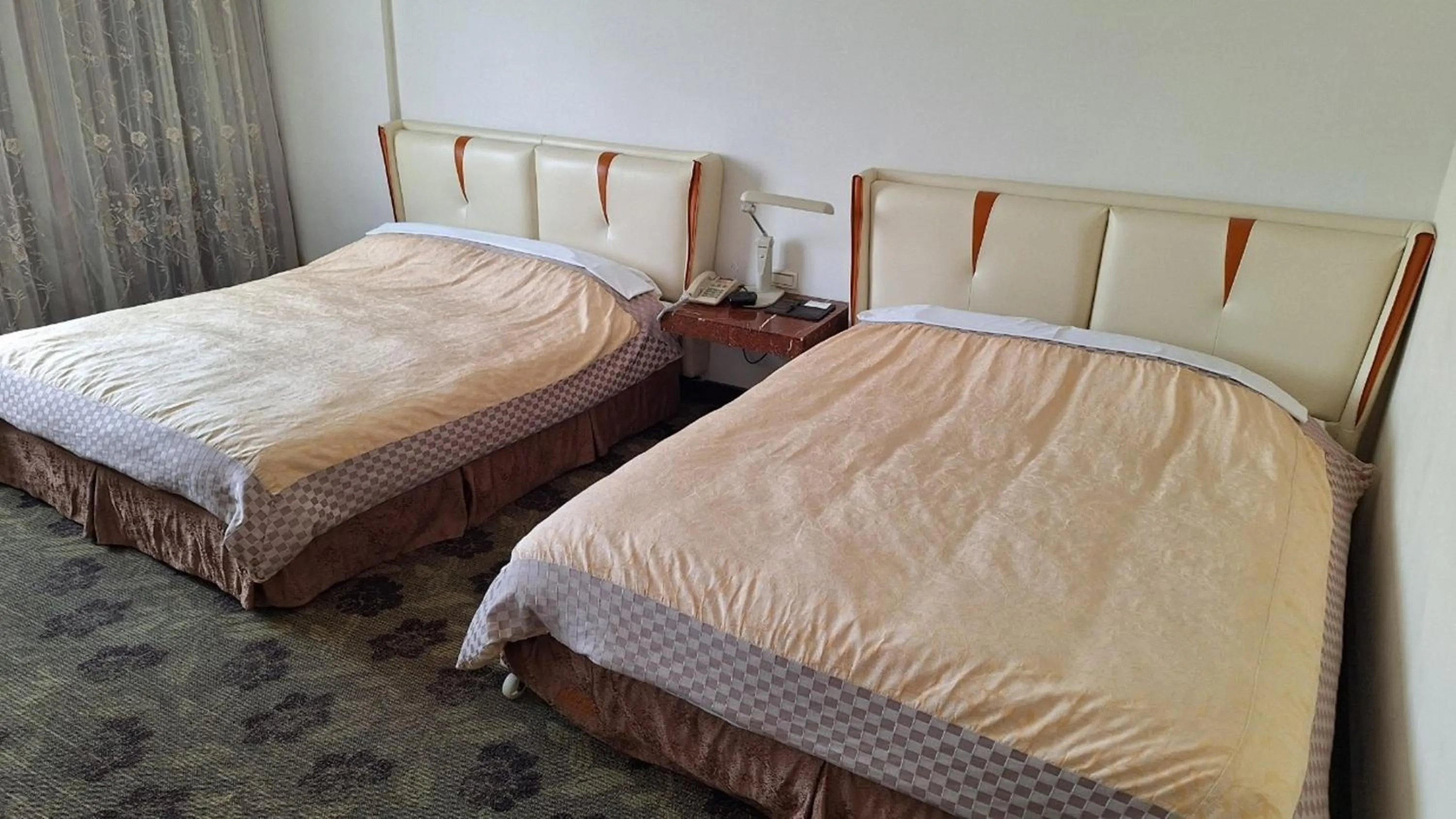 Bed in Kingship Hotel Kaohsiung Inter Continental