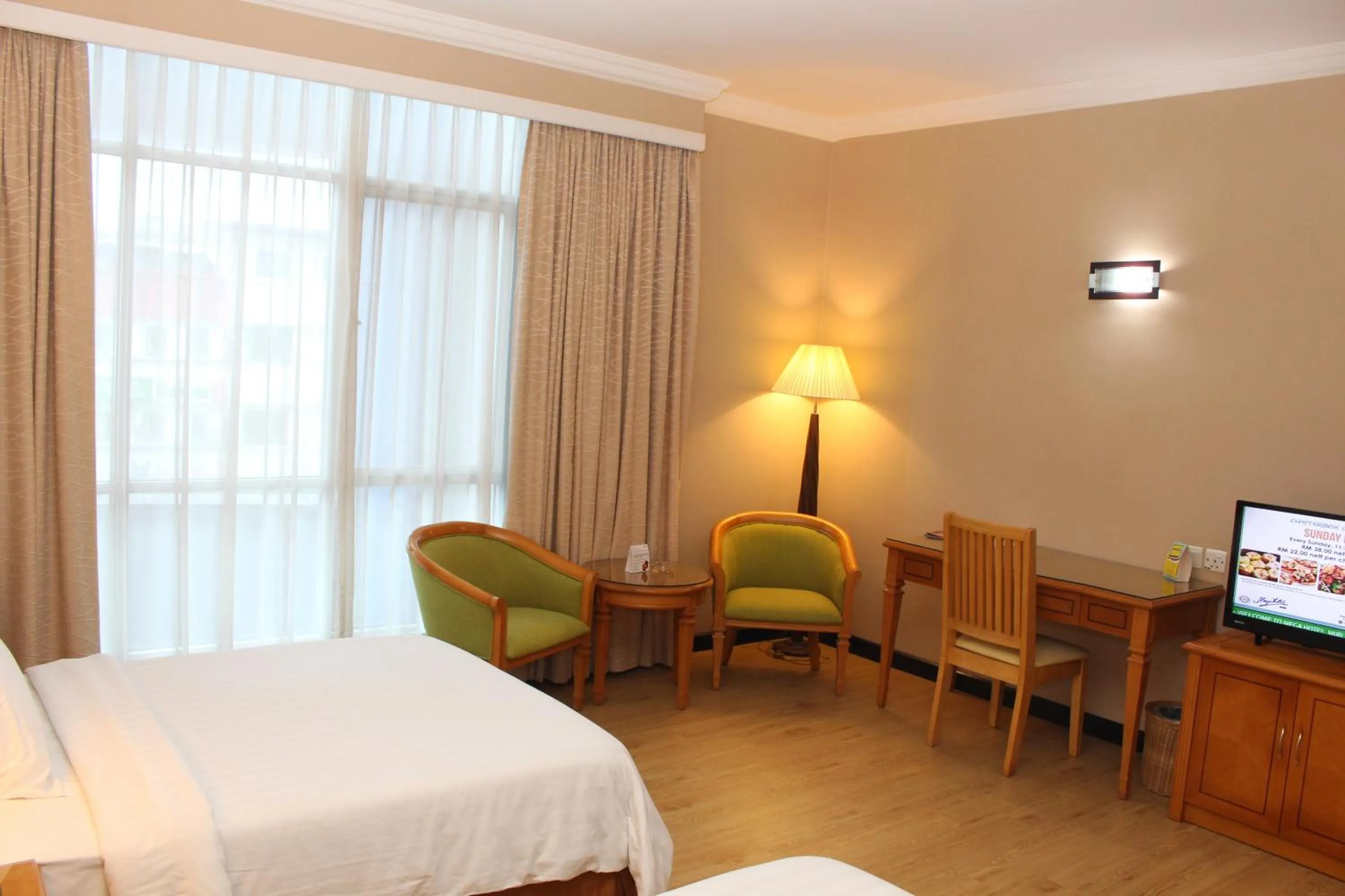 Seating area, Bed in Mega Hotel Sdn Bhd