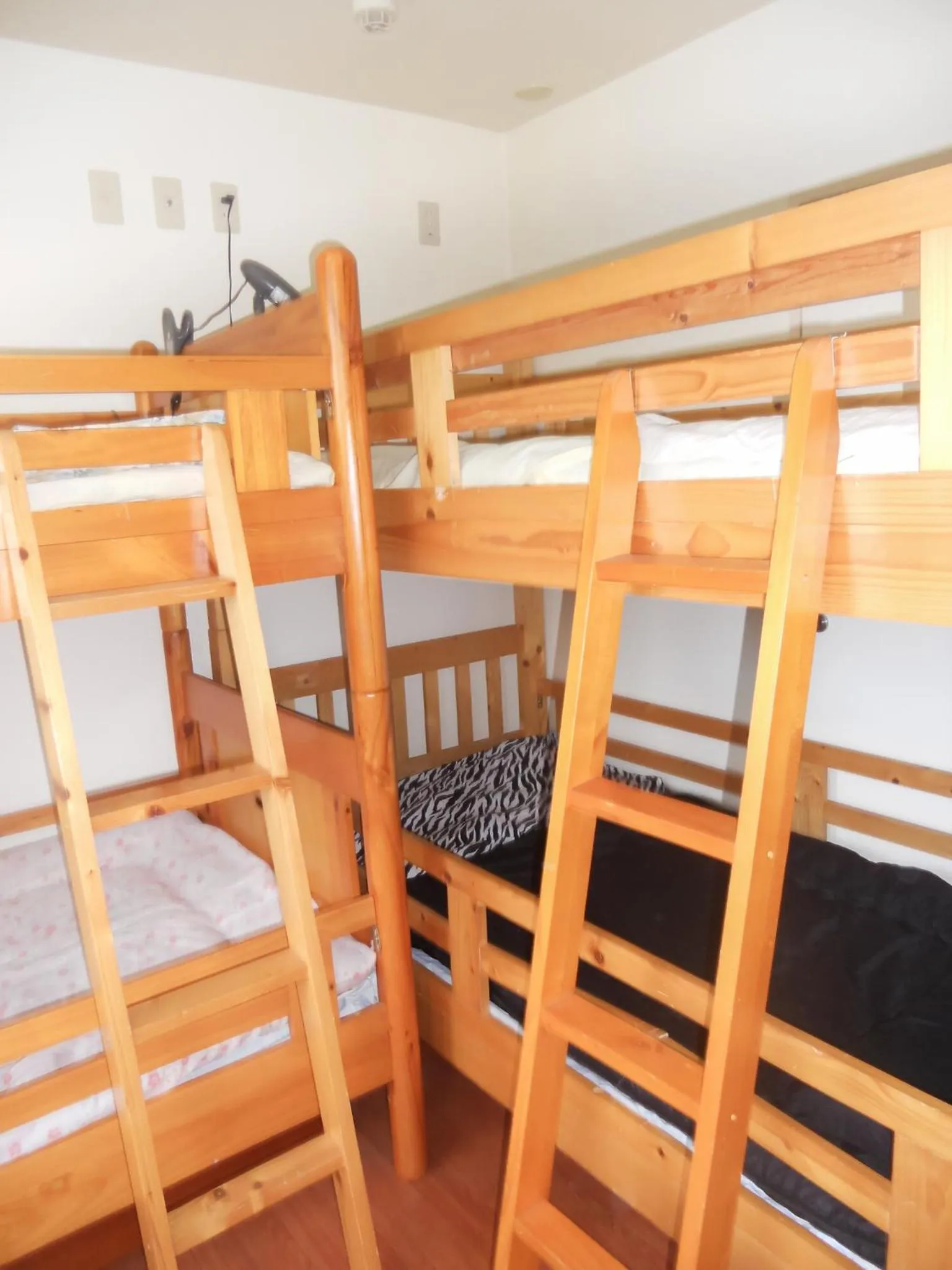 Decorative detail, Bed in Palette Takashimadaira guest house