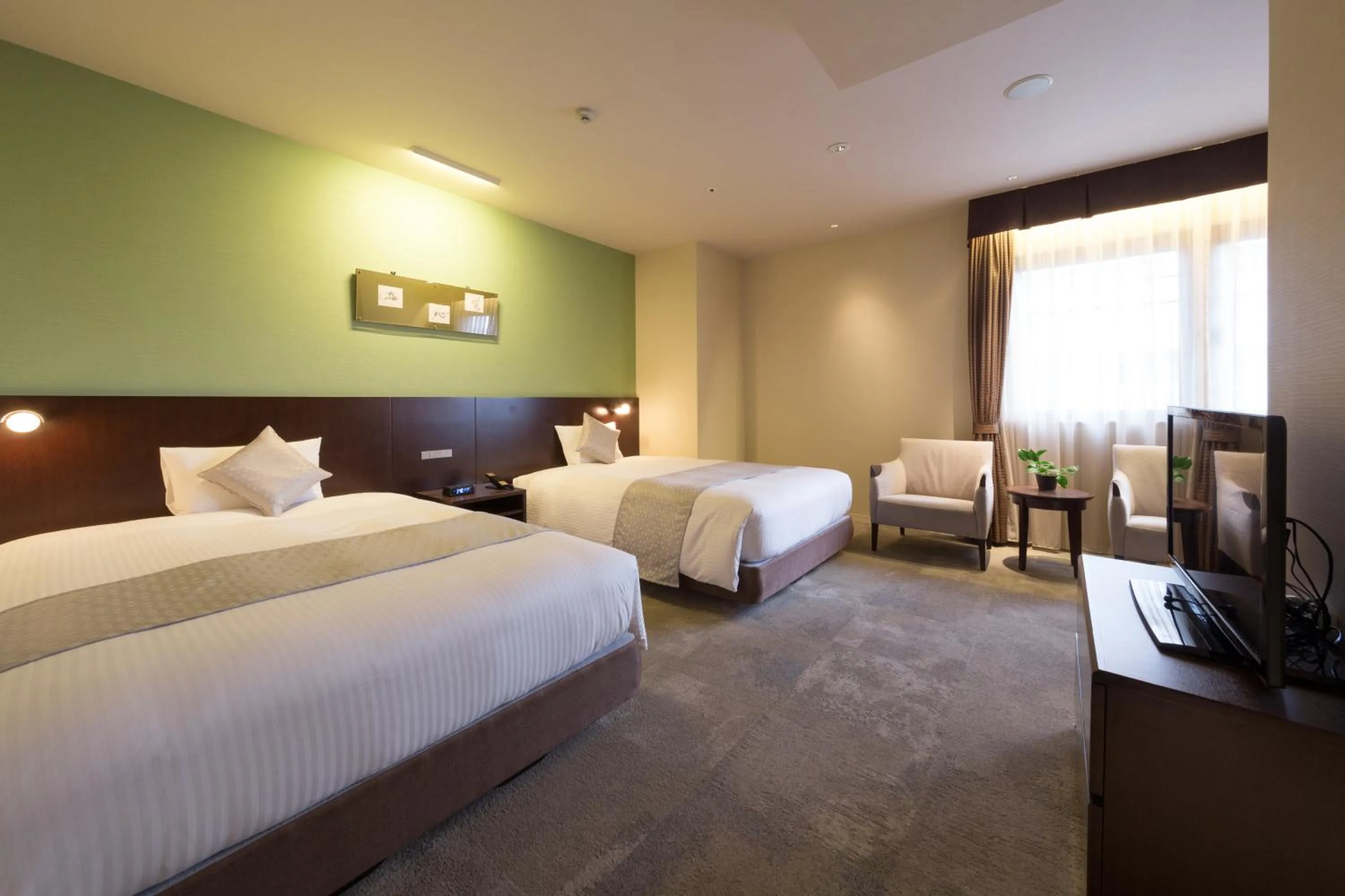 Bed in Hotel Tenjin Place