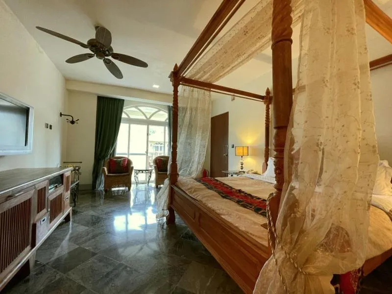 Bed in Swan Lake Villa Resort