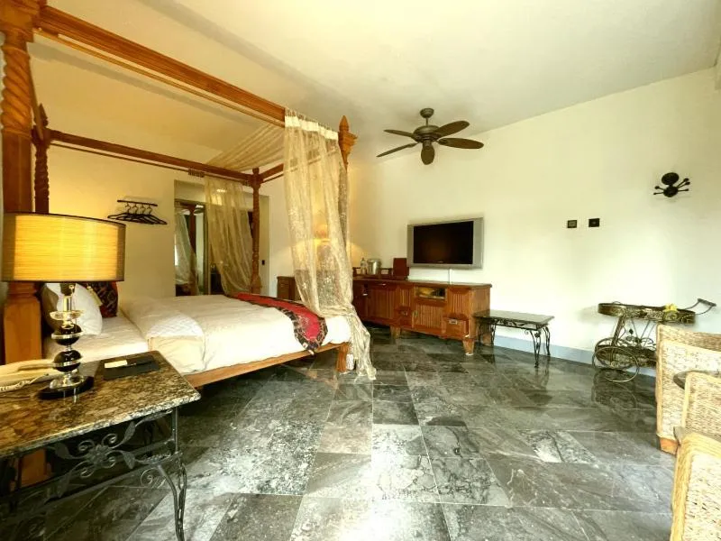 Bed in Swan Lake Villa Resort