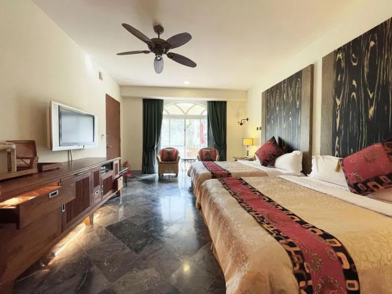Bed in Swan Lake Villa Resort