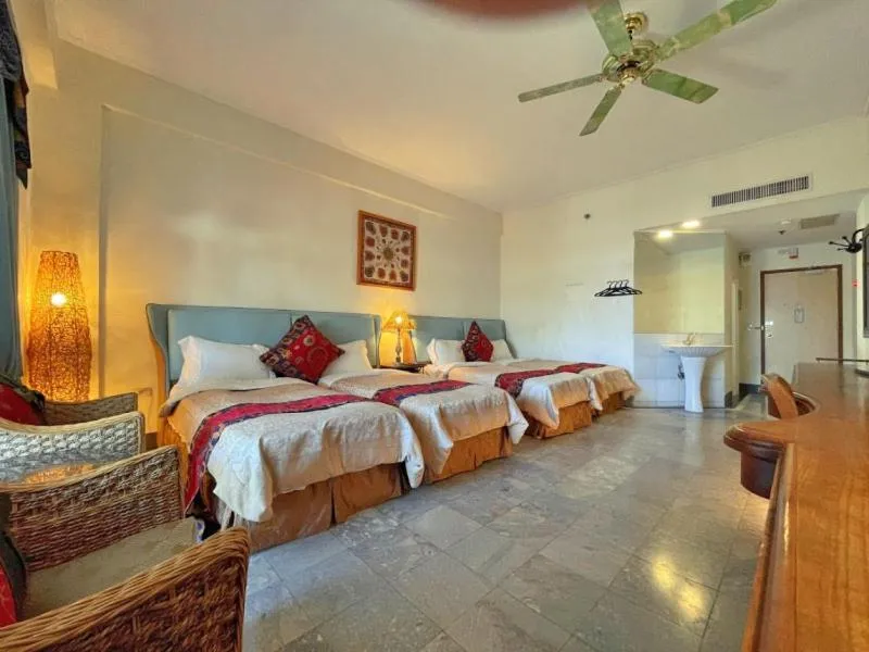 Bed in Swan Lake Villa Resort