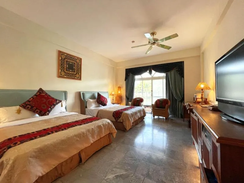 Bed in Swan Lake Villa Resort