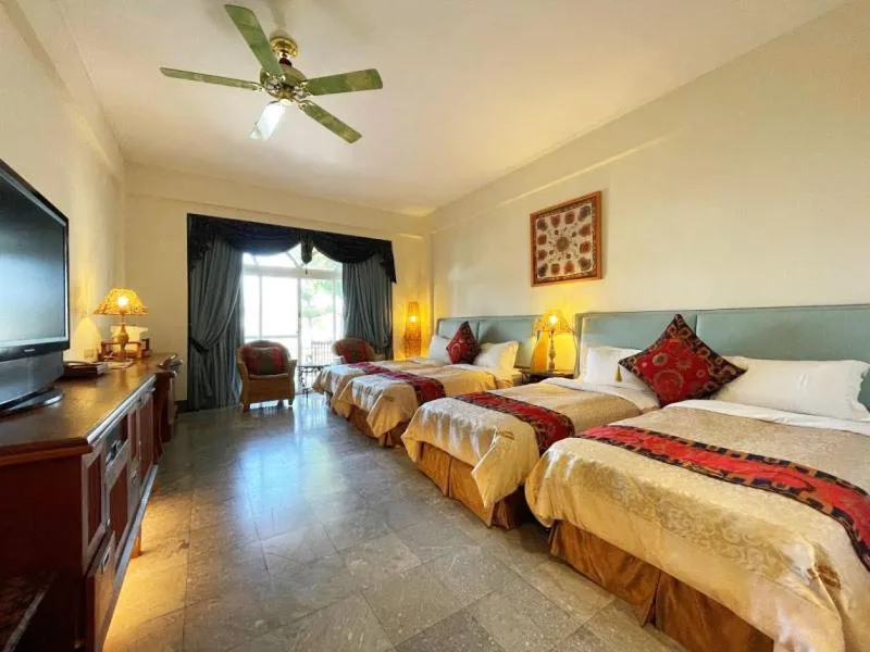 Bed in Swan Lake Villa Resort