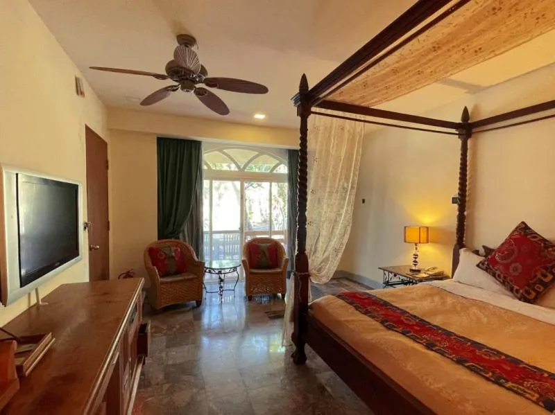 Bed in Swan Lake Villa Resort