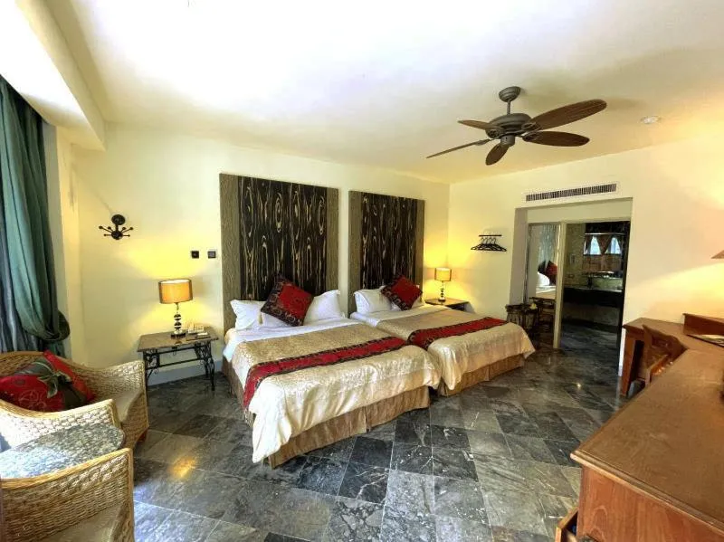 Bed in Swan Lake Villa Resort