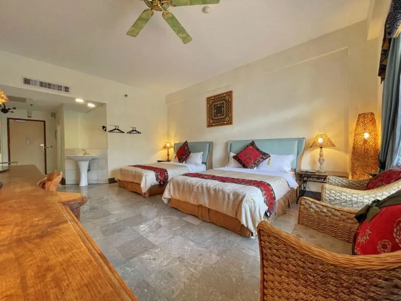Bed in Swan Lake Villa Resort