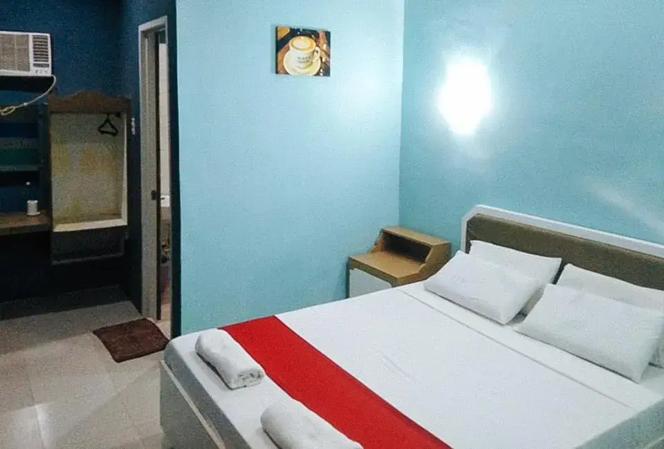 Bed in RedDoorz at EM Pensiontel Butuan City Bed in RedDoorz at EM Pensiontel Butuan City