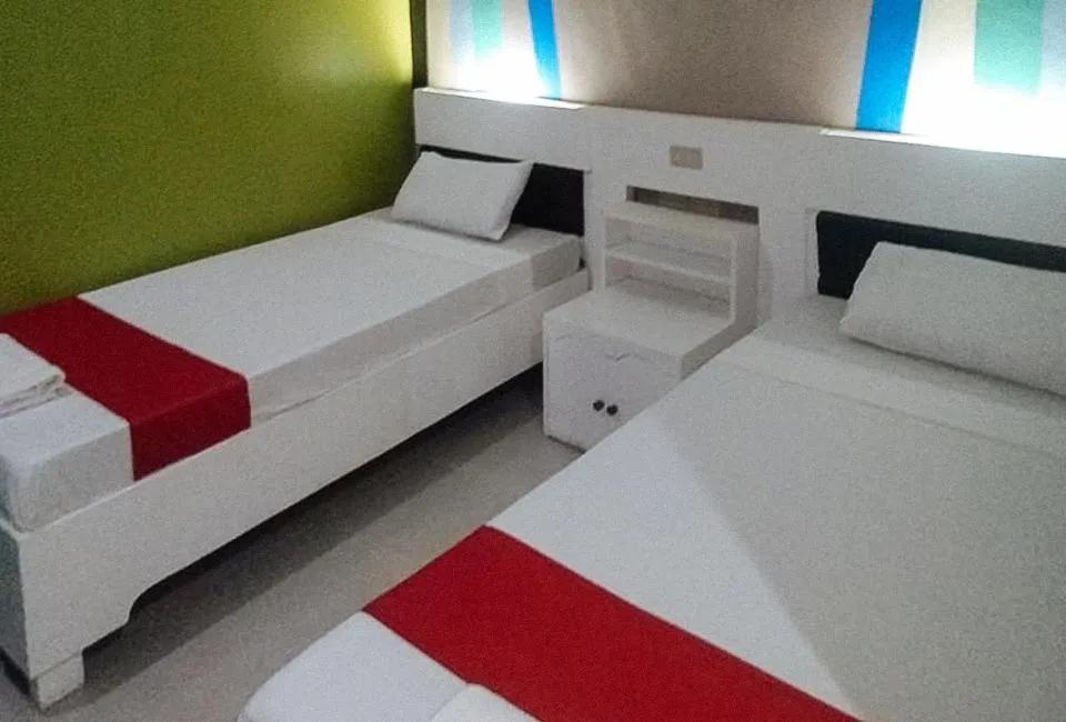Bed in RedDoorz at EM Pensiontel Butuan City