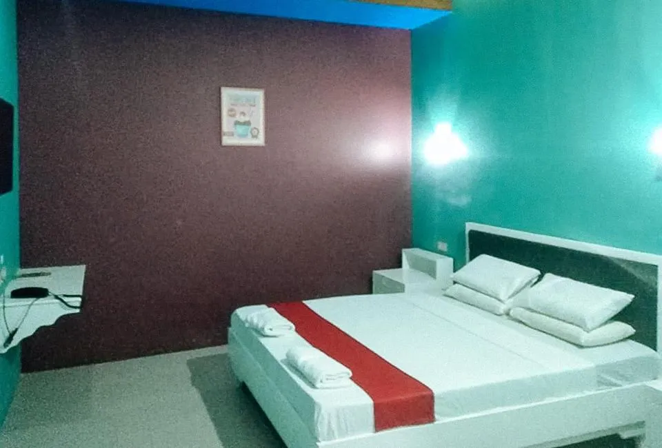 Bed in RedDoorz at EM Pensiontel Butuan City