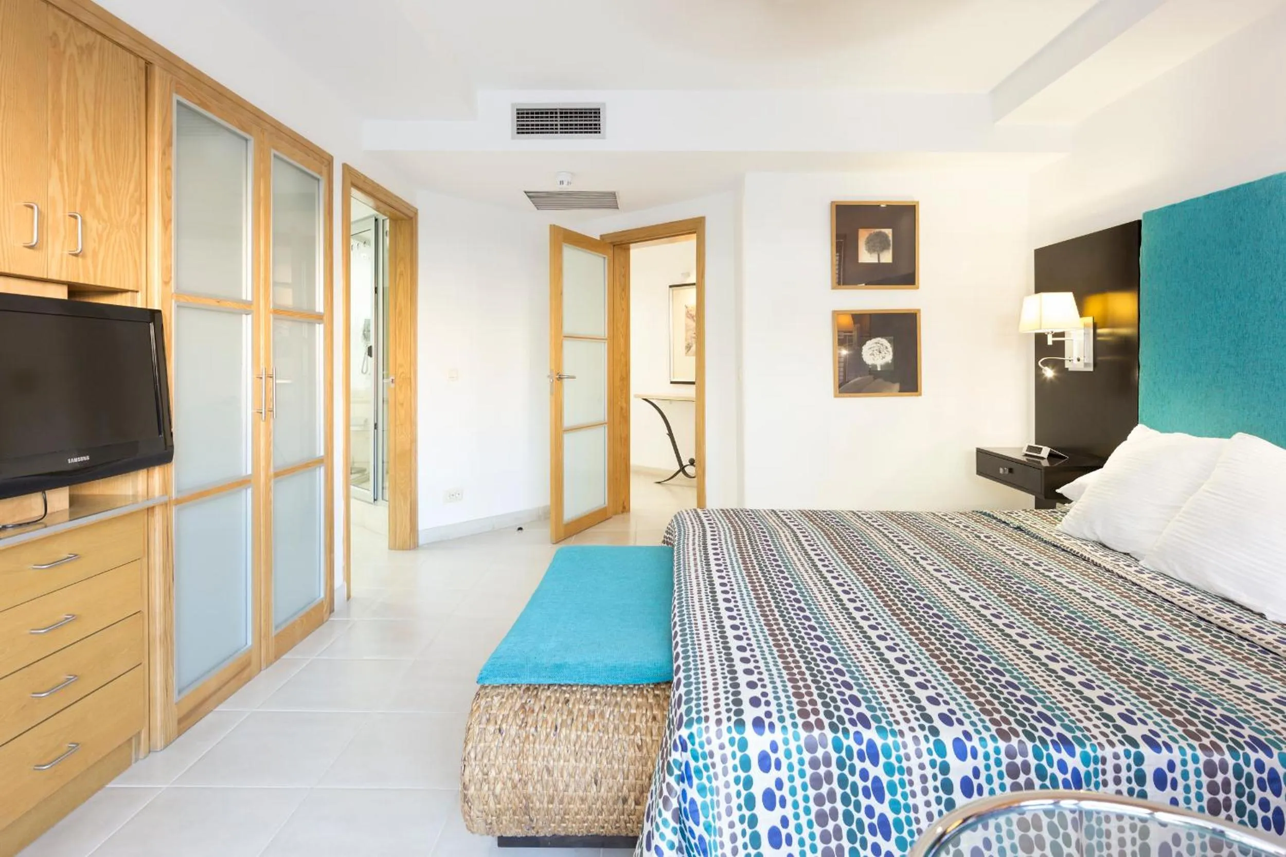 Bedroom, TV/Entertainment Center in Atlas Suites Tenerife by EnjoyaHome