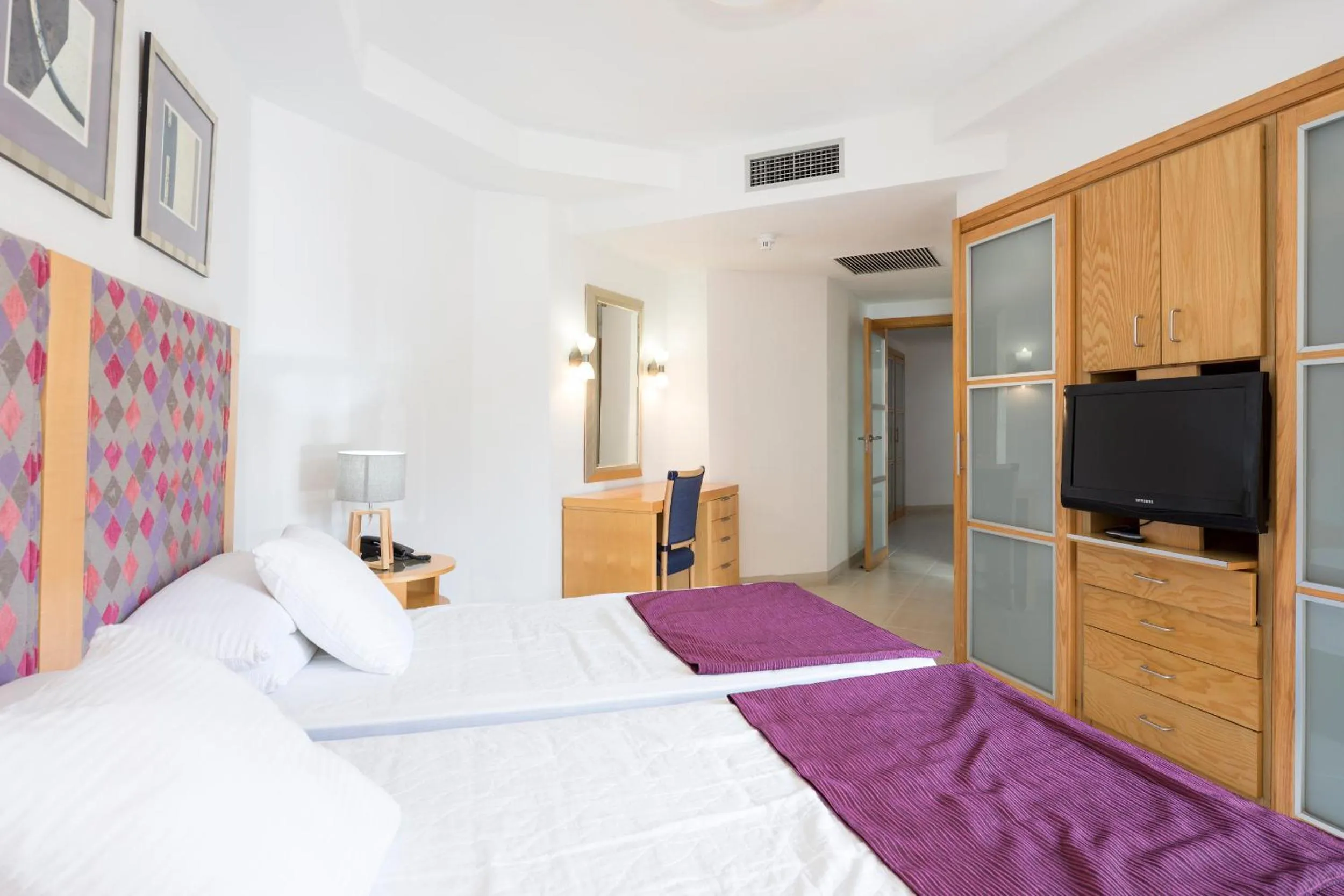 Bed, TV/Entertainment Center in Atlas Suites Tenerife by EnjoyaHome