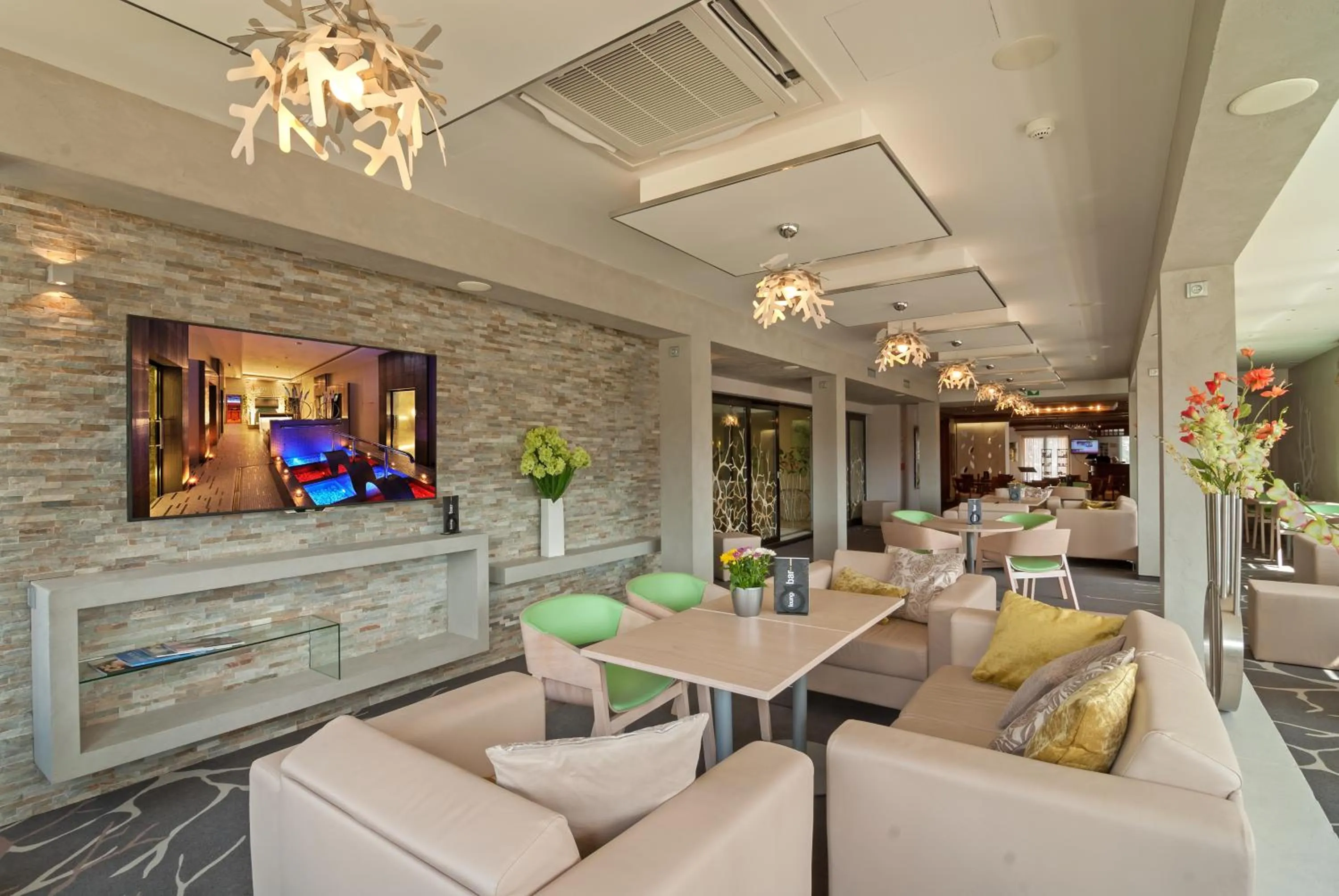 Communal lounge/ TV room in Harmony Hotel