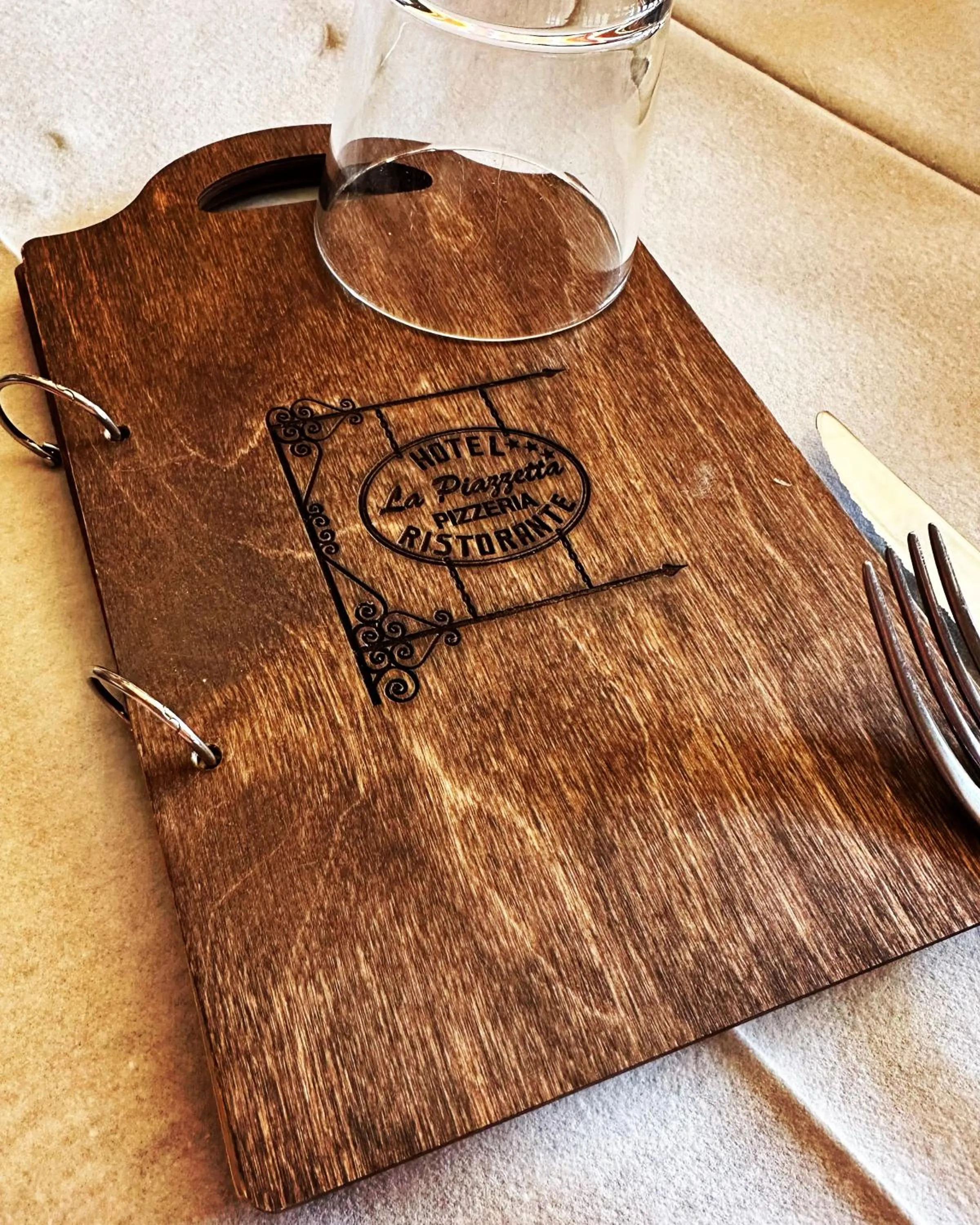 Property logo or sign in Hotel La Piazzetta