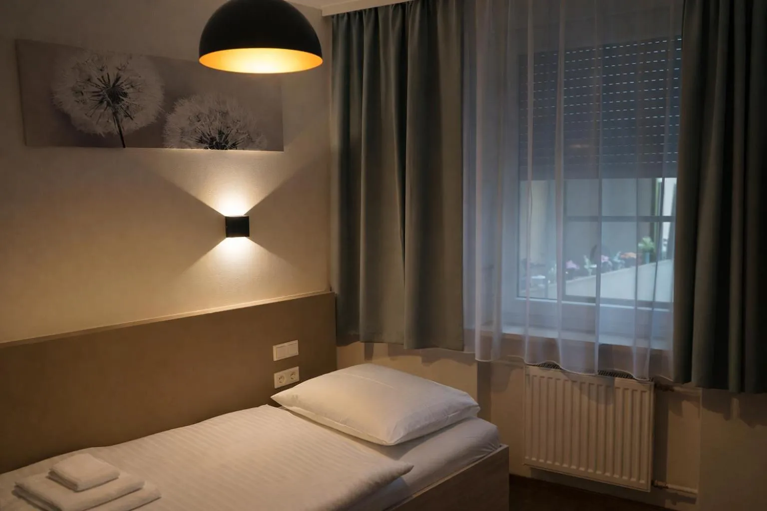Photo of the whole room, Bed in Hotel Central City Hbf Nürnberg Garni