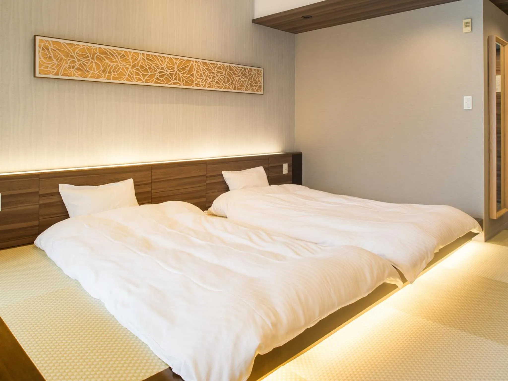 Bed in Izu-Kogen Wan Wan Paradise Hotel & Cottage