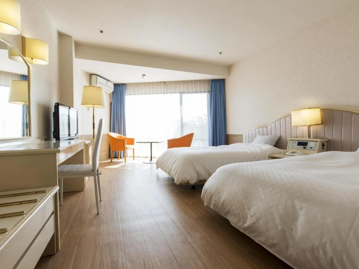 Bed in Izu-Kogen Wan Wan Paradise Hotel & Cottage