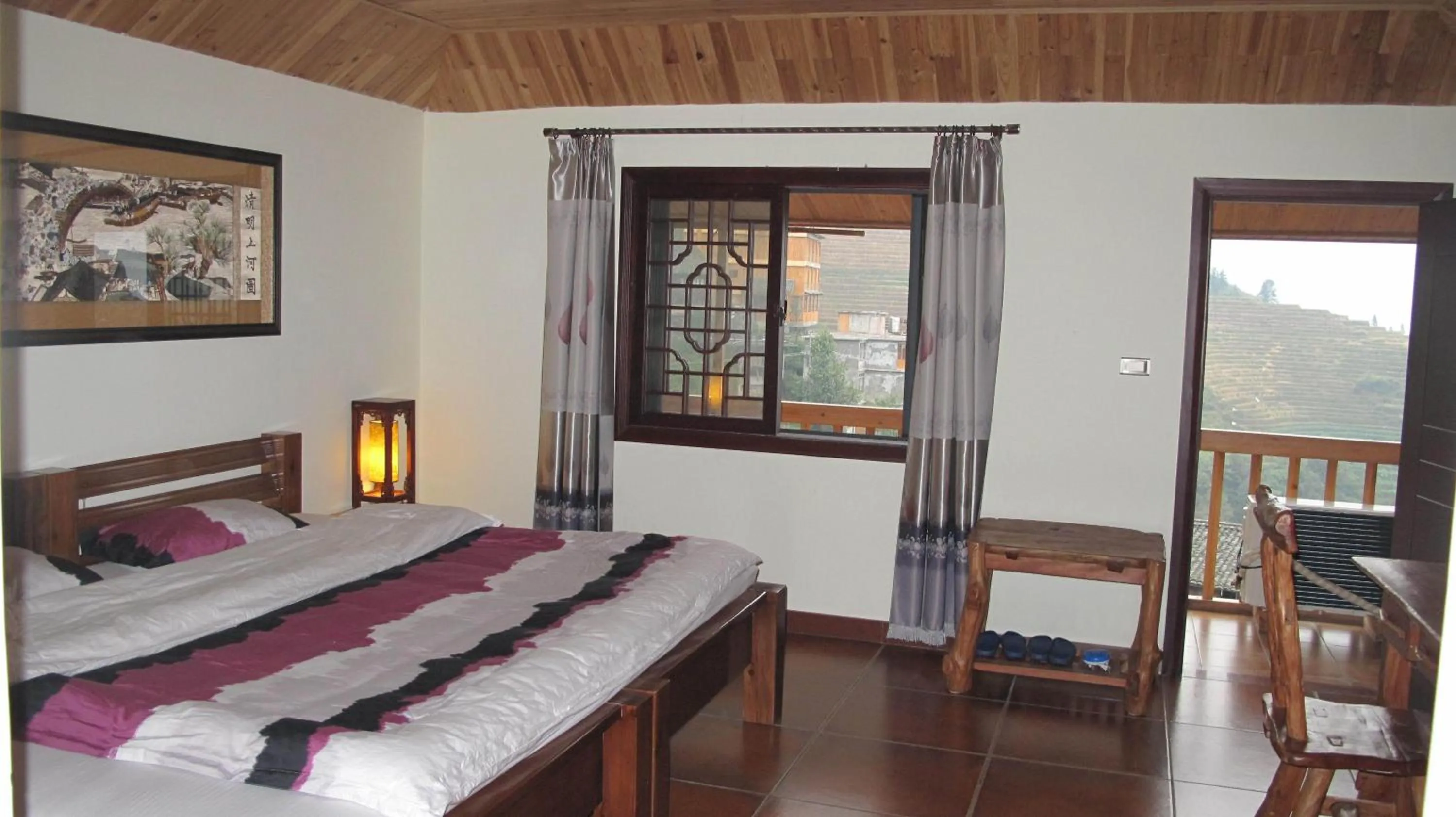 Bed in Longji Holiday Hotel