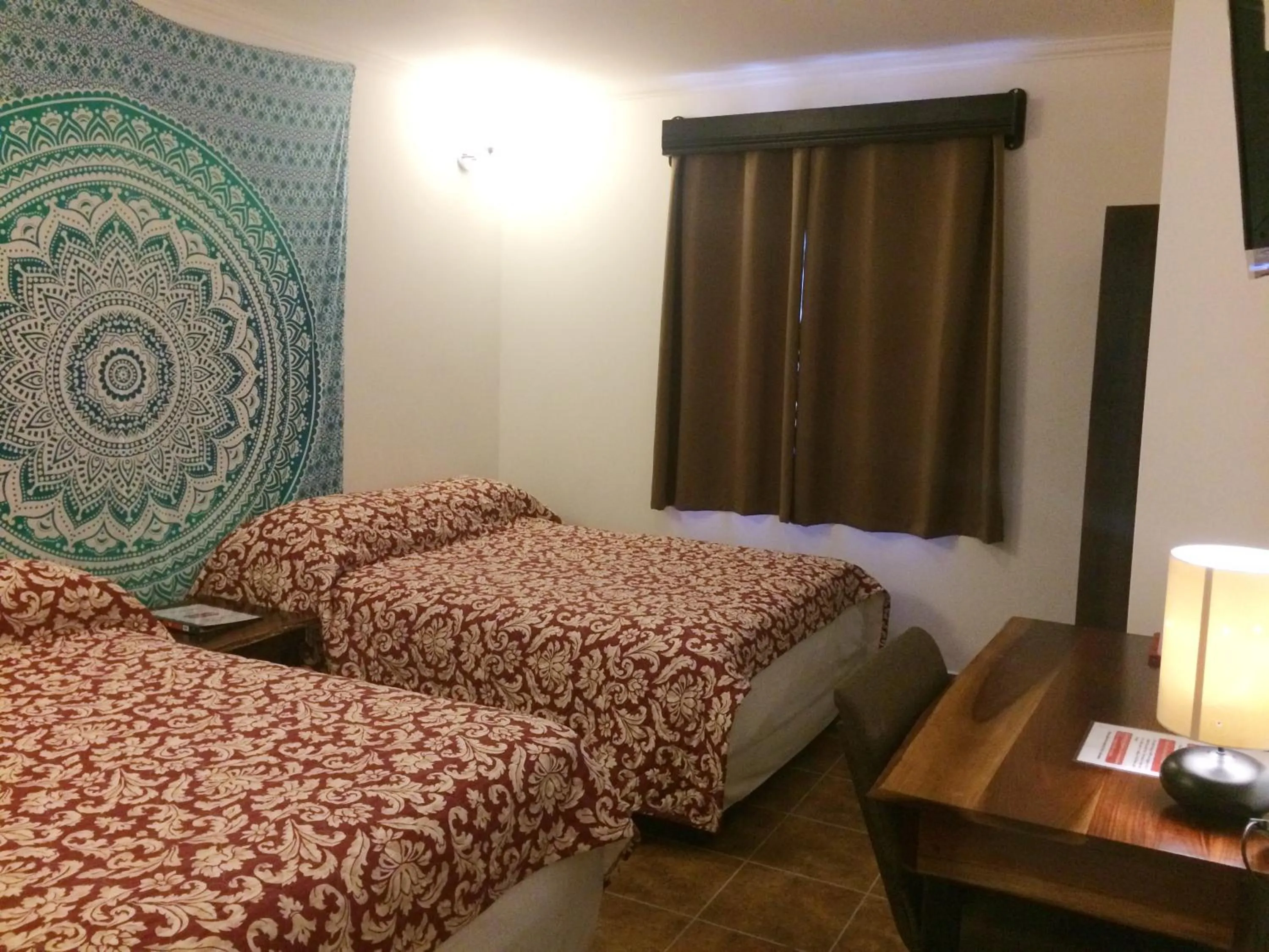 Bed in Easy Inn Hotel