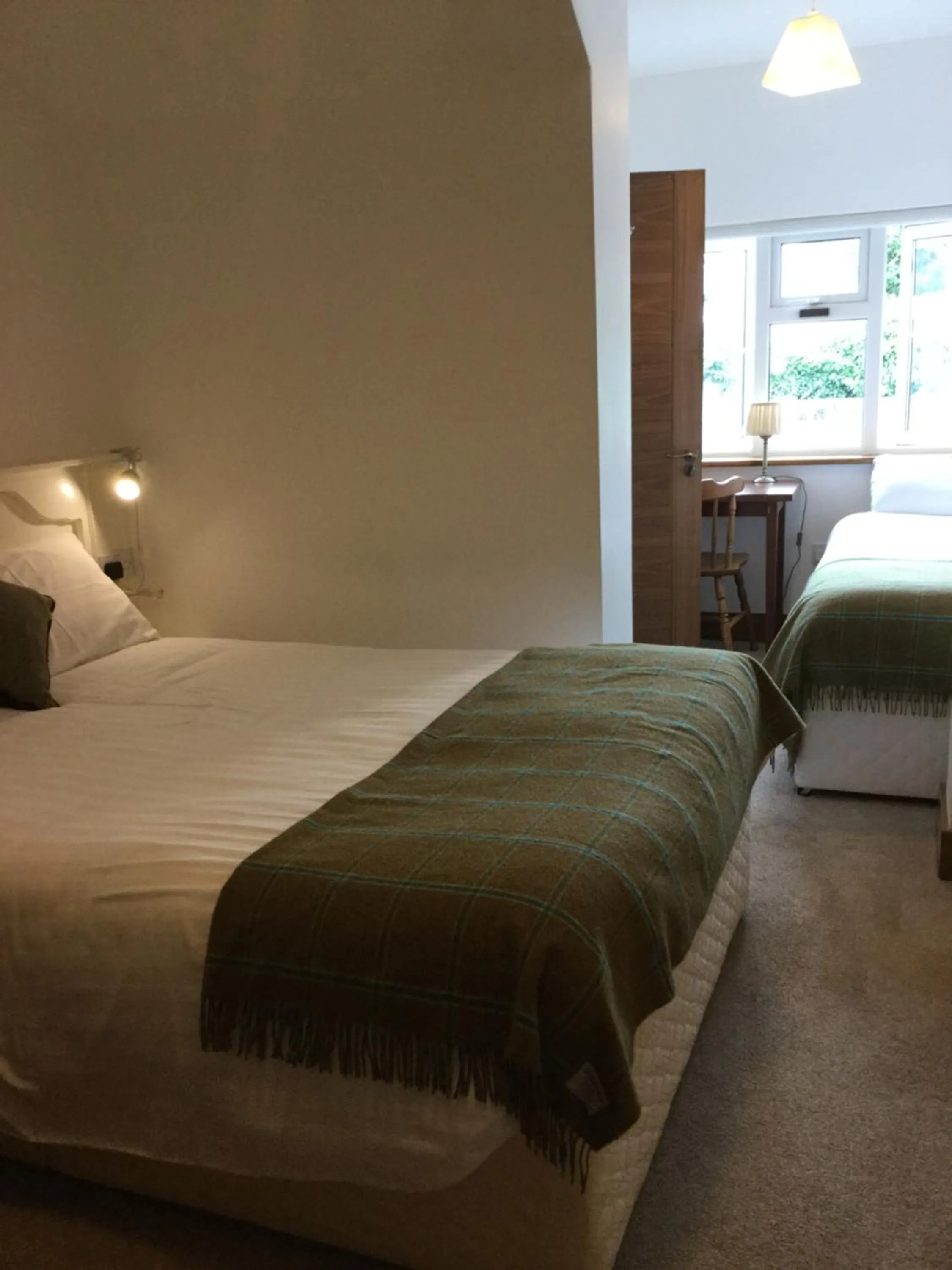 Bed in Ryan's River Lodge B&B