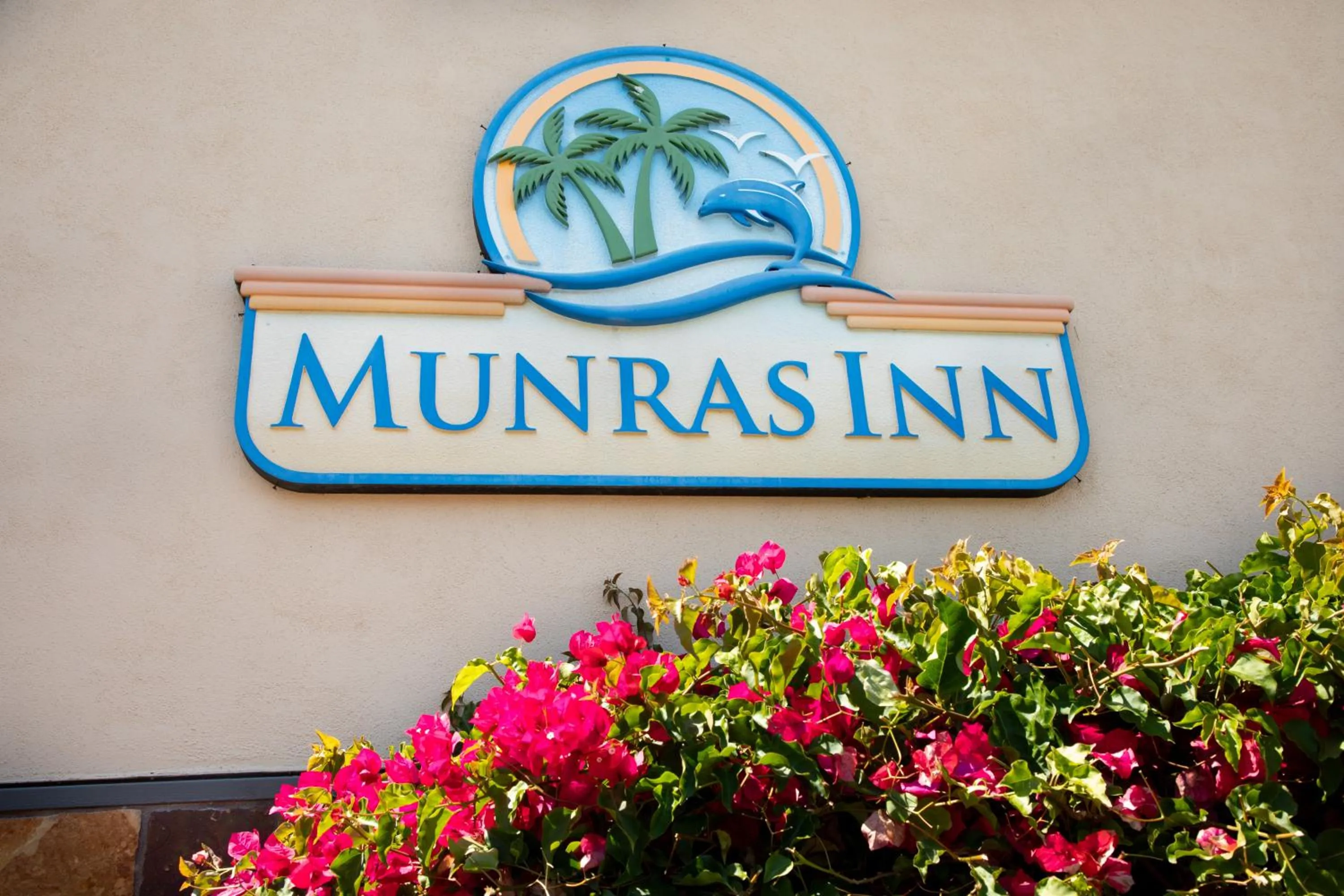 Property logo or sign in Munras Inn