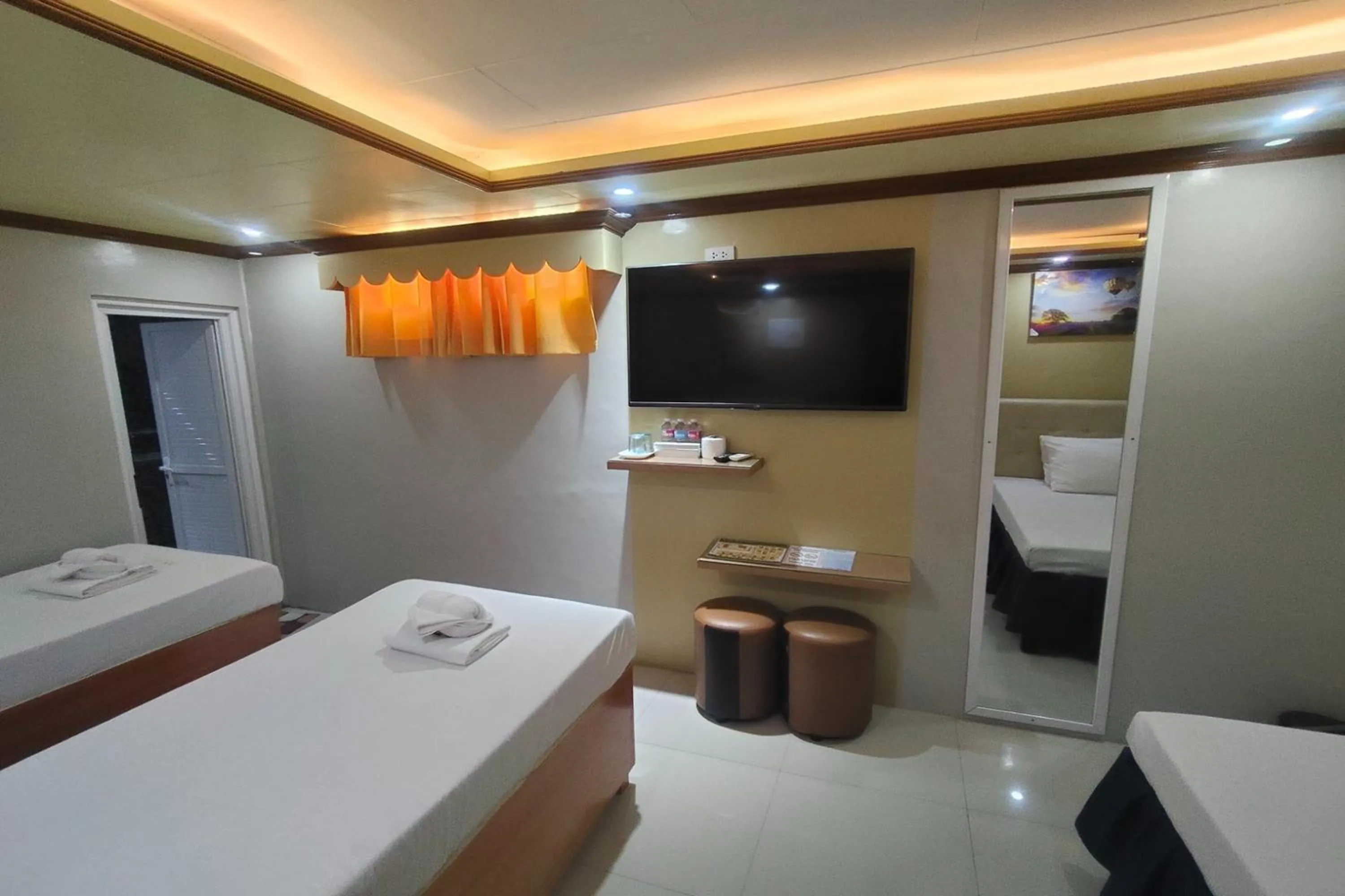 Photo of the whole room, Bed in Taj Hotel Tuguegarao