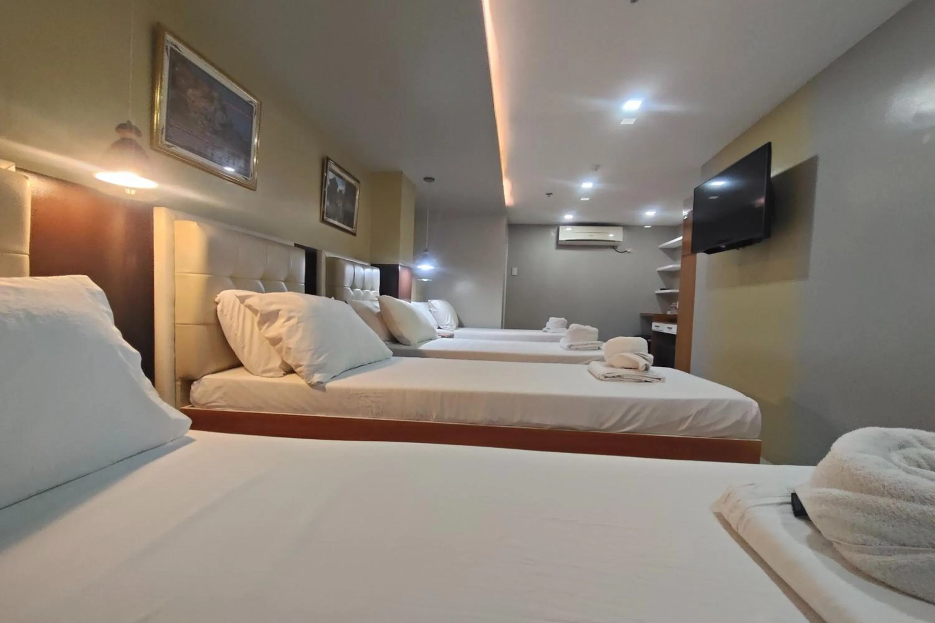 Photo of the whole room, Bed in Taj Hotel Tuguegarao