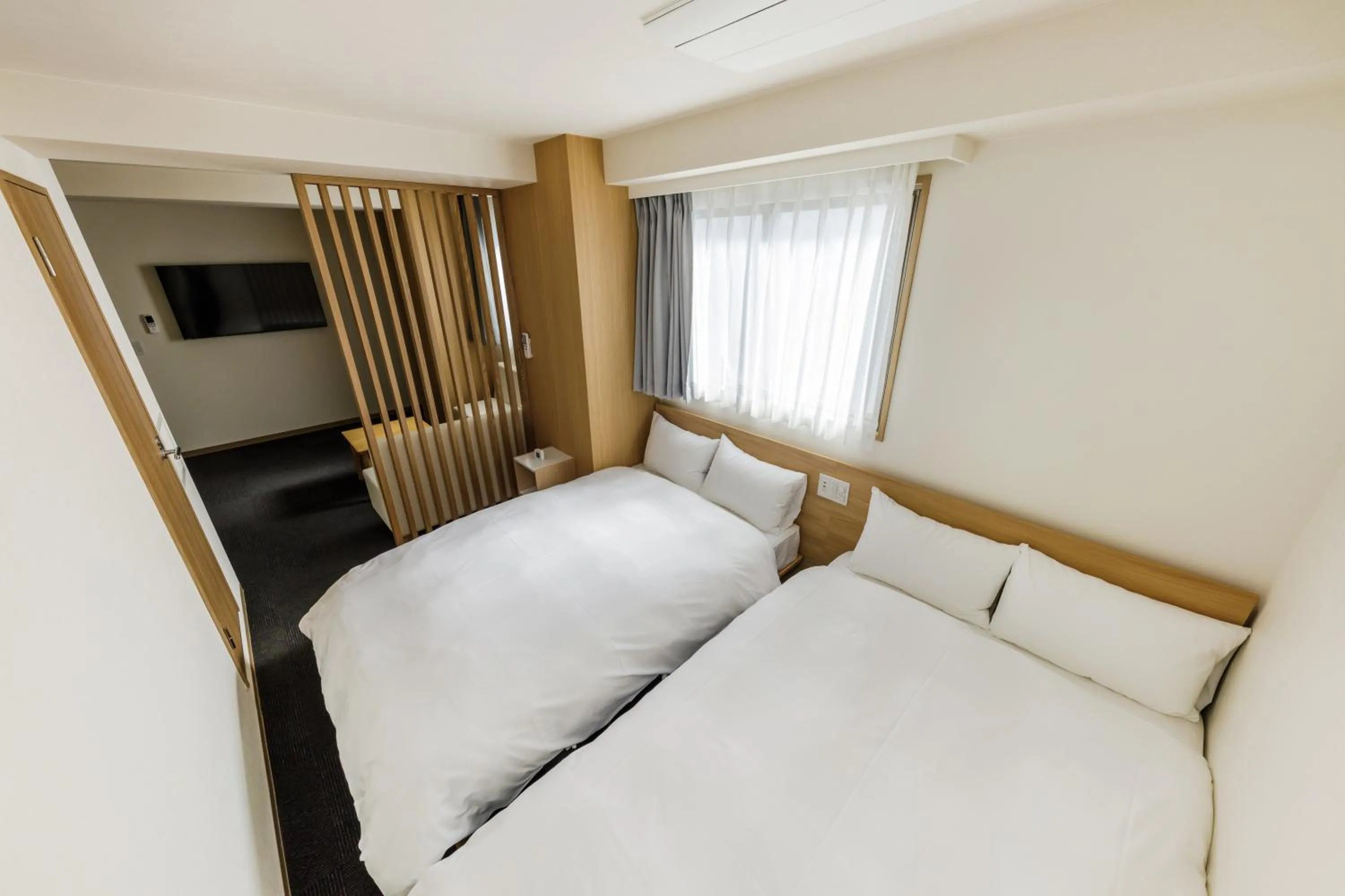 Bed in HOPETREE OSAKA GRAND