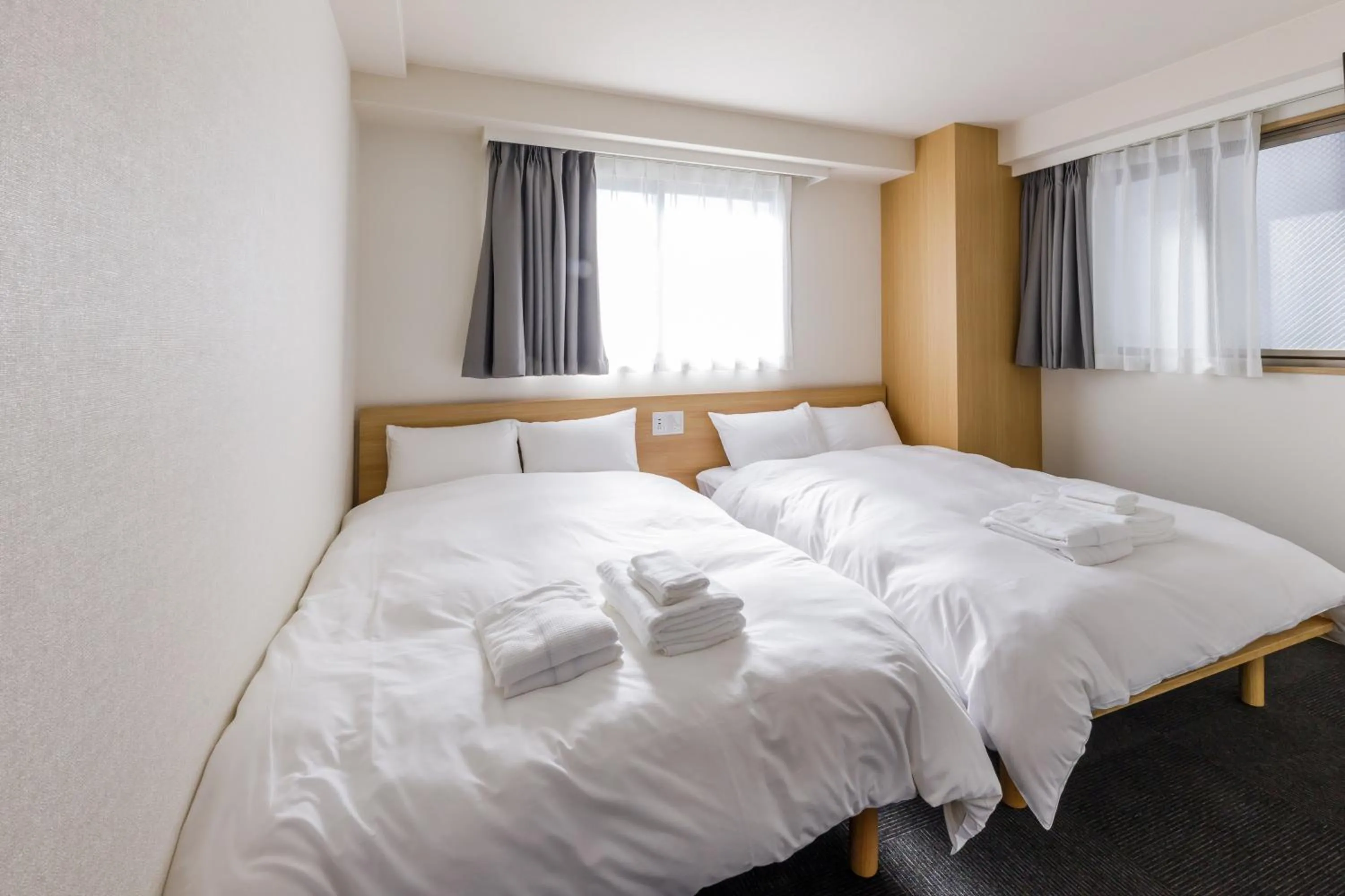 Bed in HOPETREE OSAKA GRAND