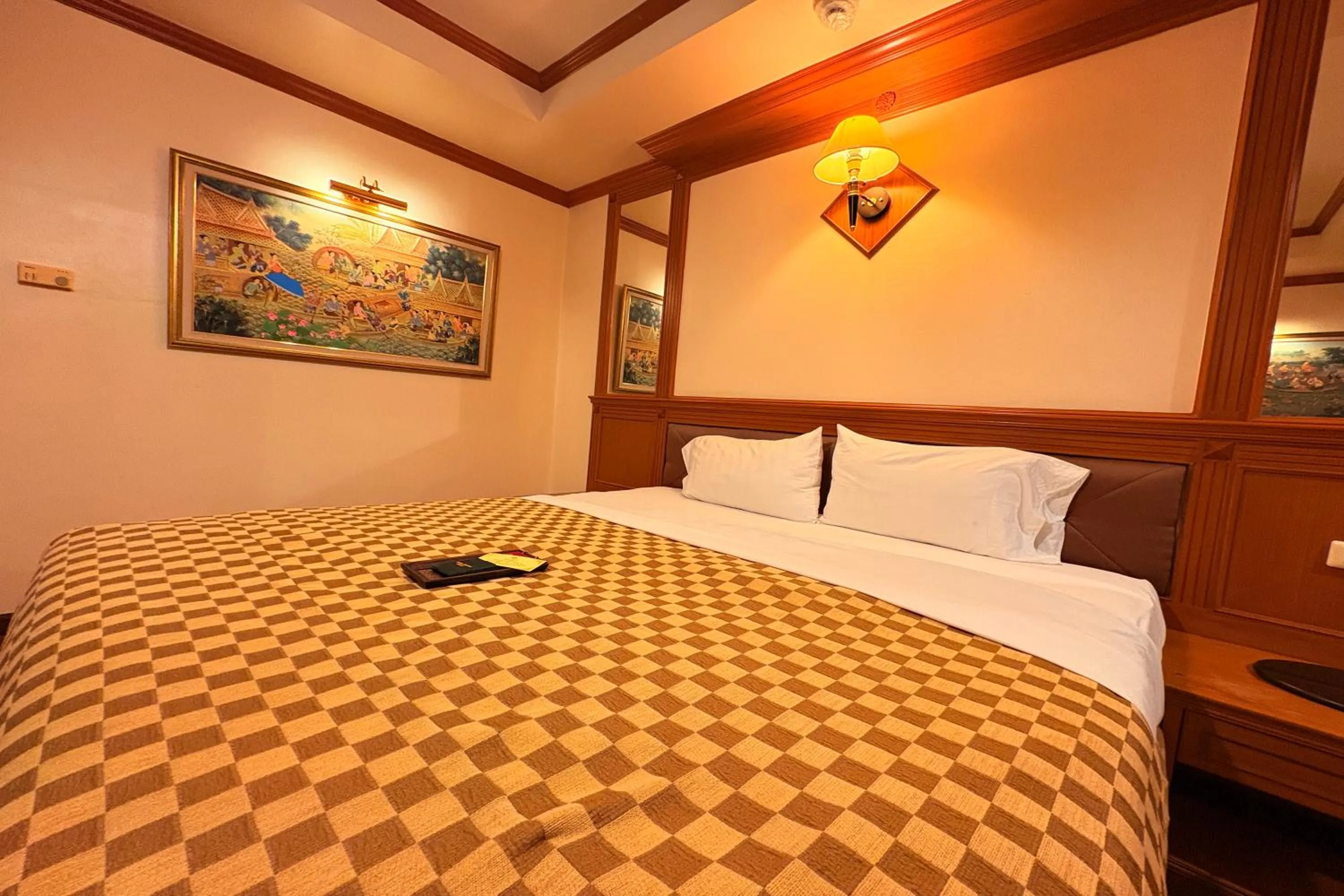 Bed in Taksila Hotel