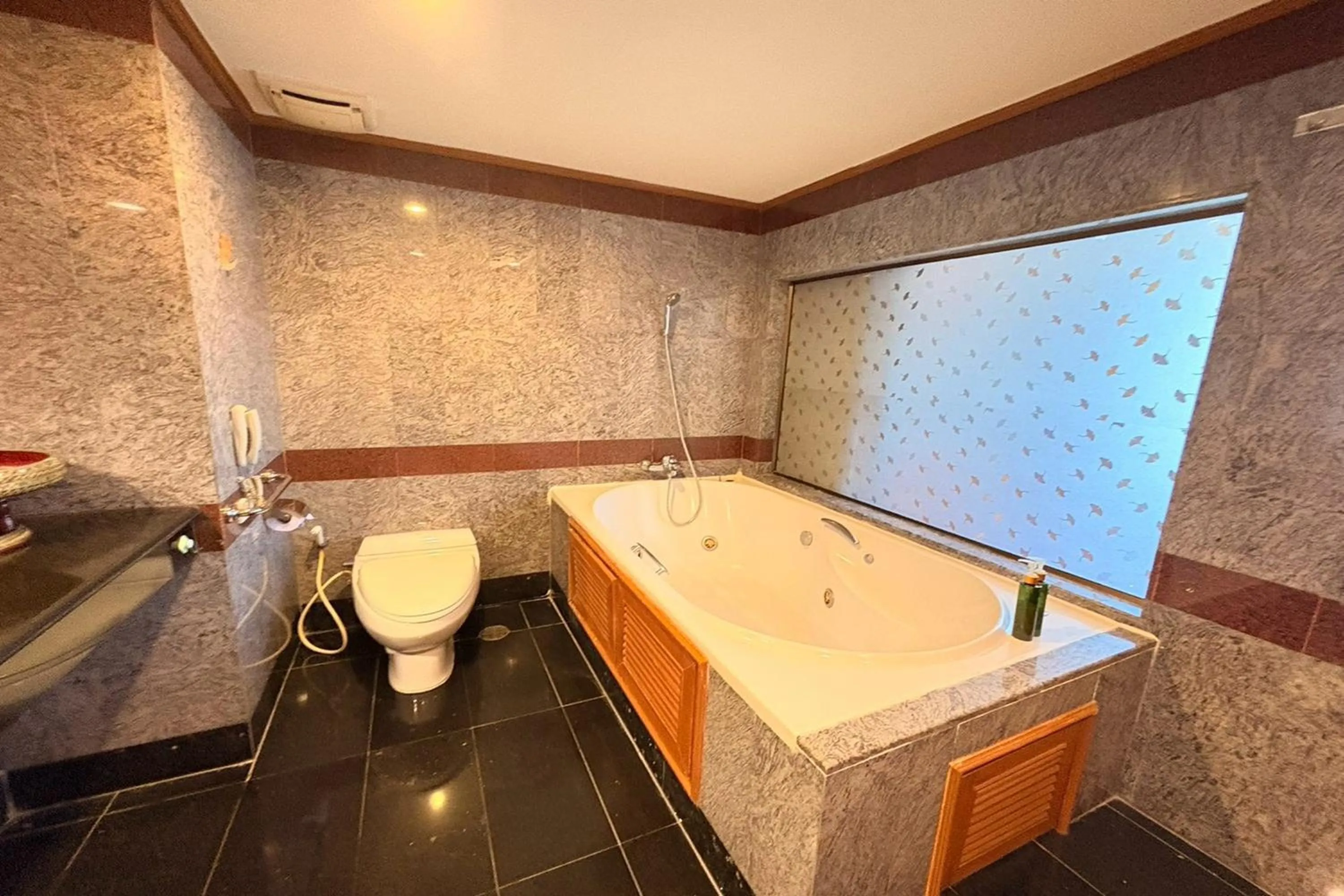 Bathroom in Taksila Hotel
