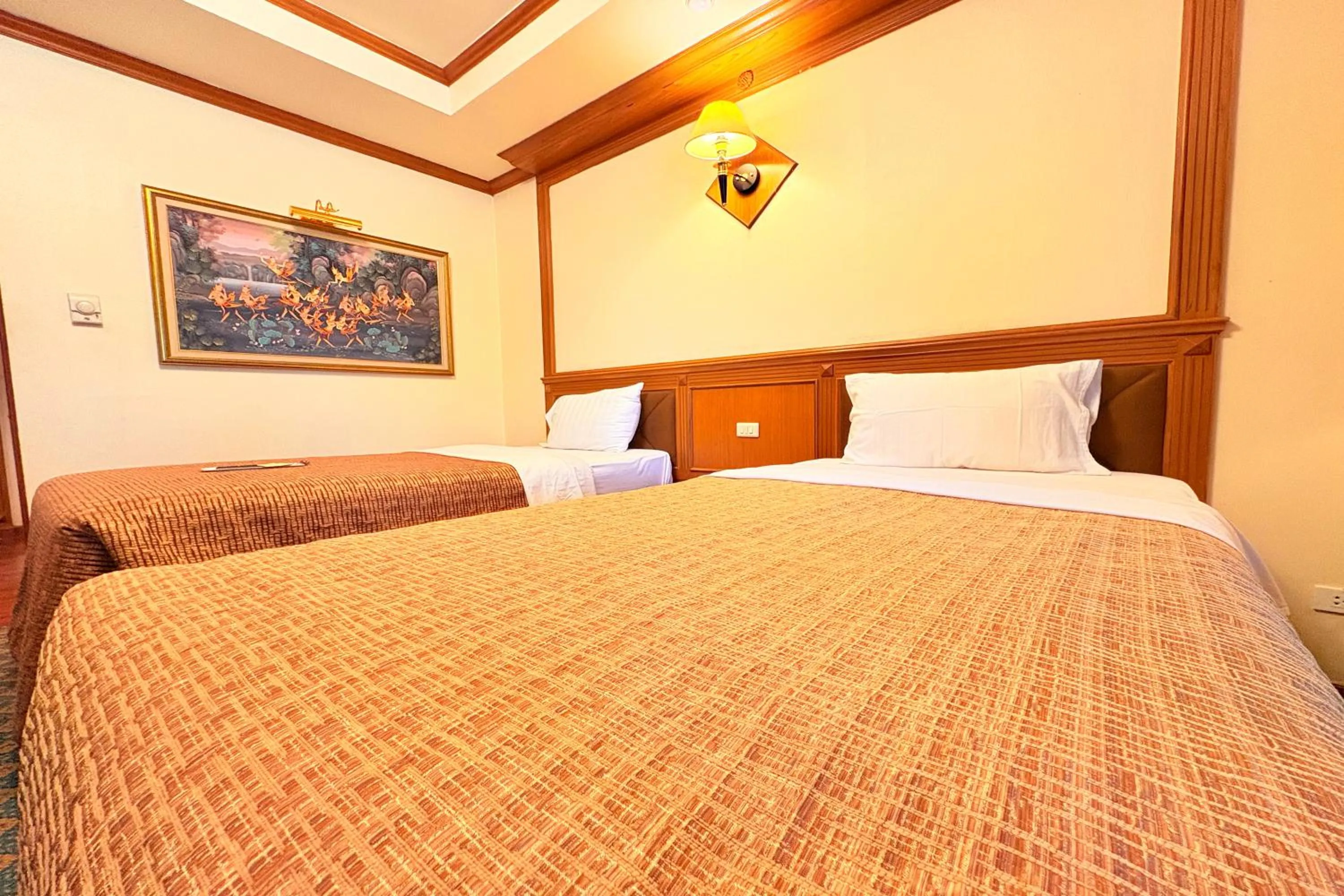 Bed in Taksila Hotel