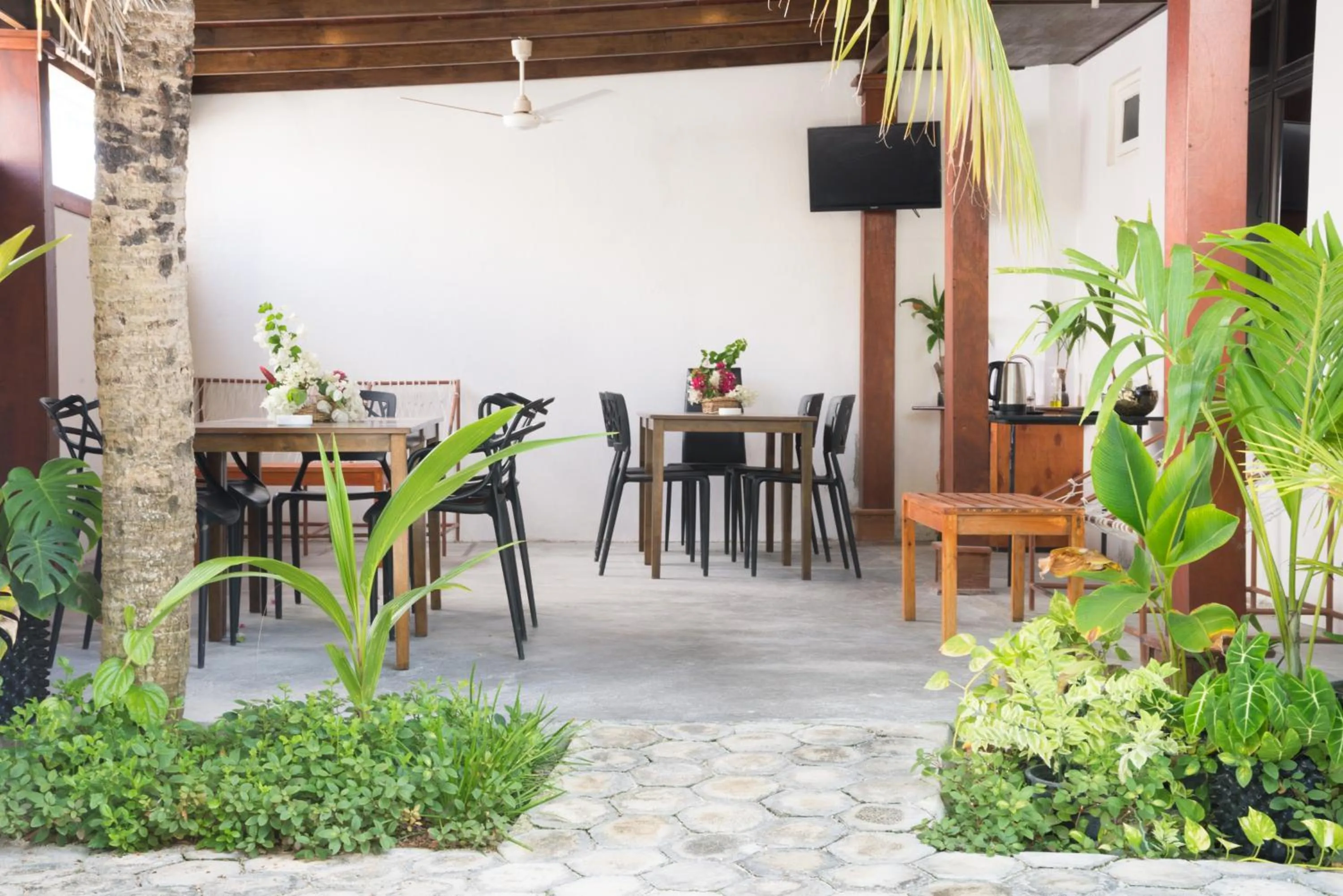 Communal lounge/ TV room in Palm Gate Maldives