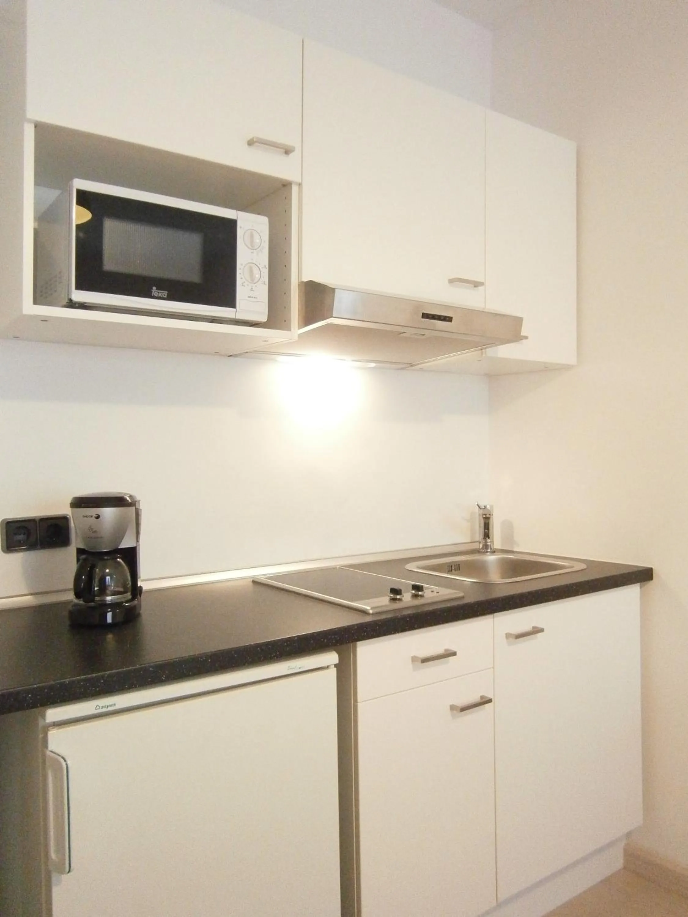 Kitchen or kitchenette in Marbel Apartments