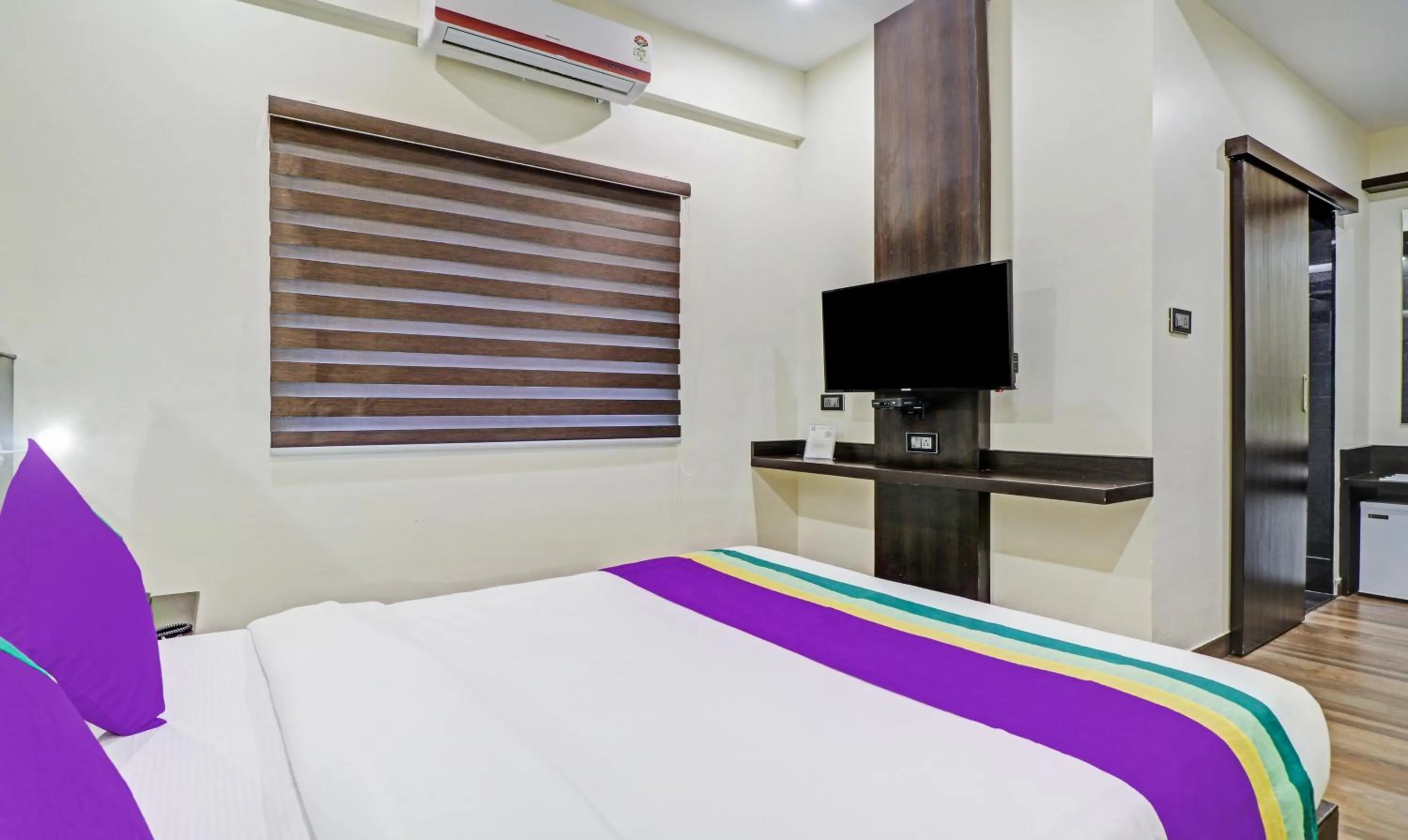 Bedroom, Bed in Treebo Premium Raj Vista Global Village