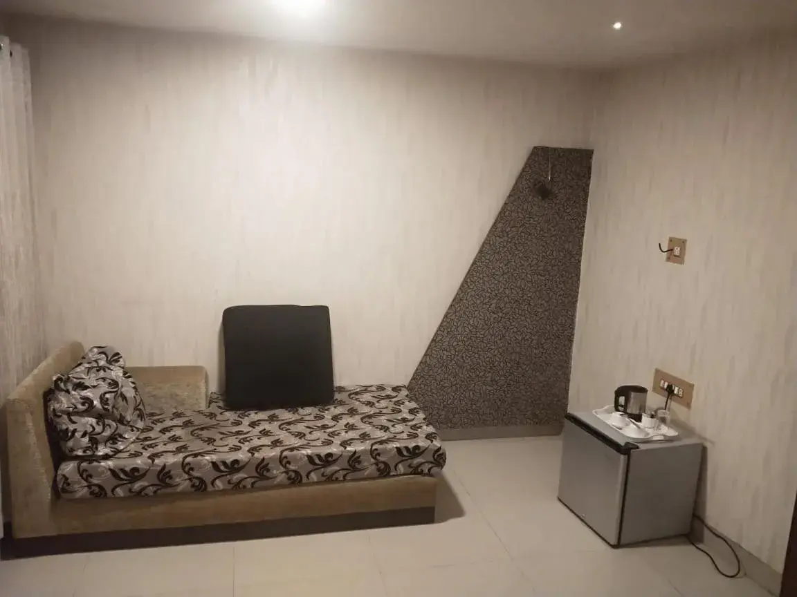 Seating area, Bed in Hotel Eastern Plaza Seating area, Bed in Hotel Eastern Plaza