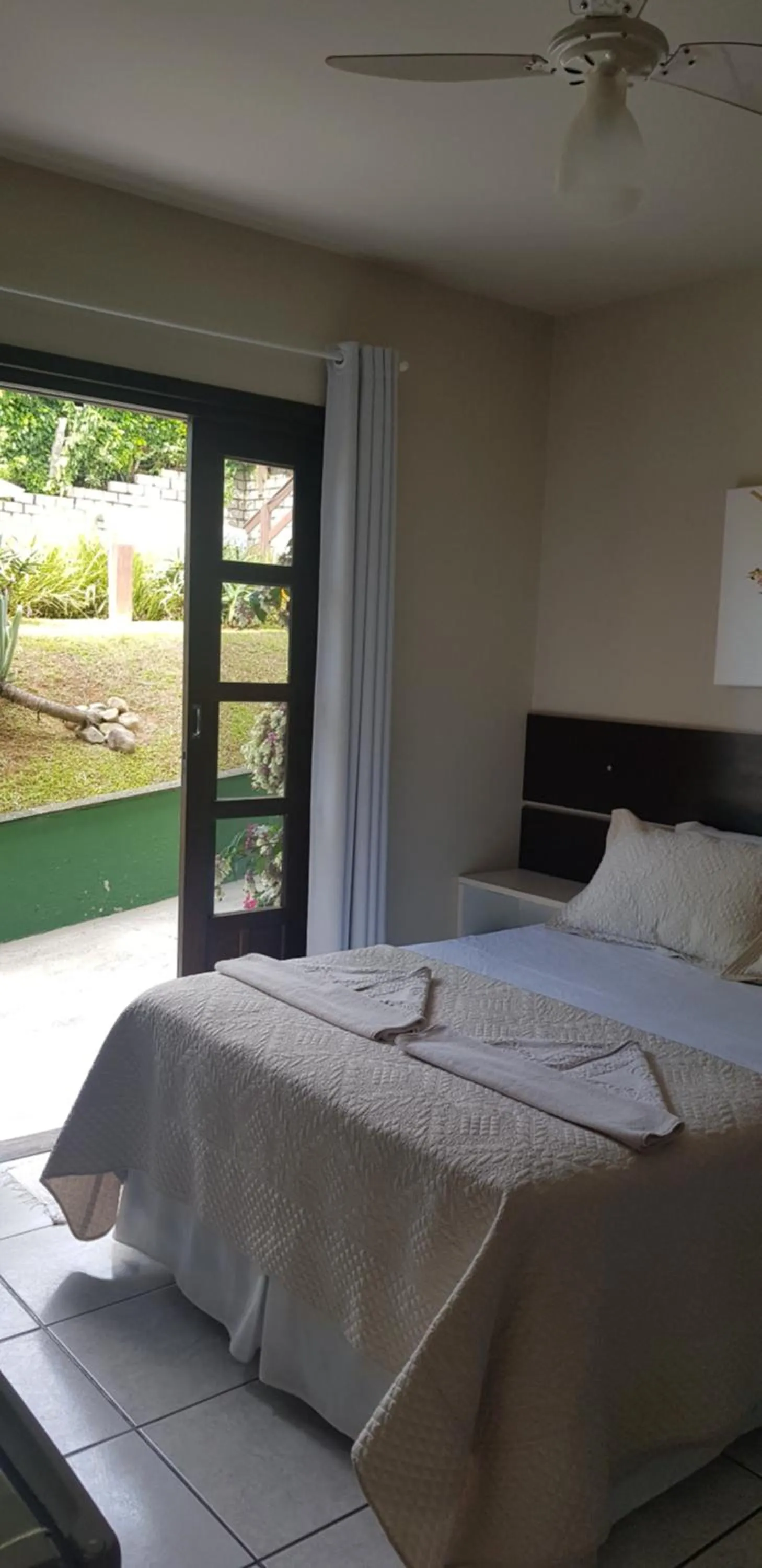 Bed in Pousada Guaruja