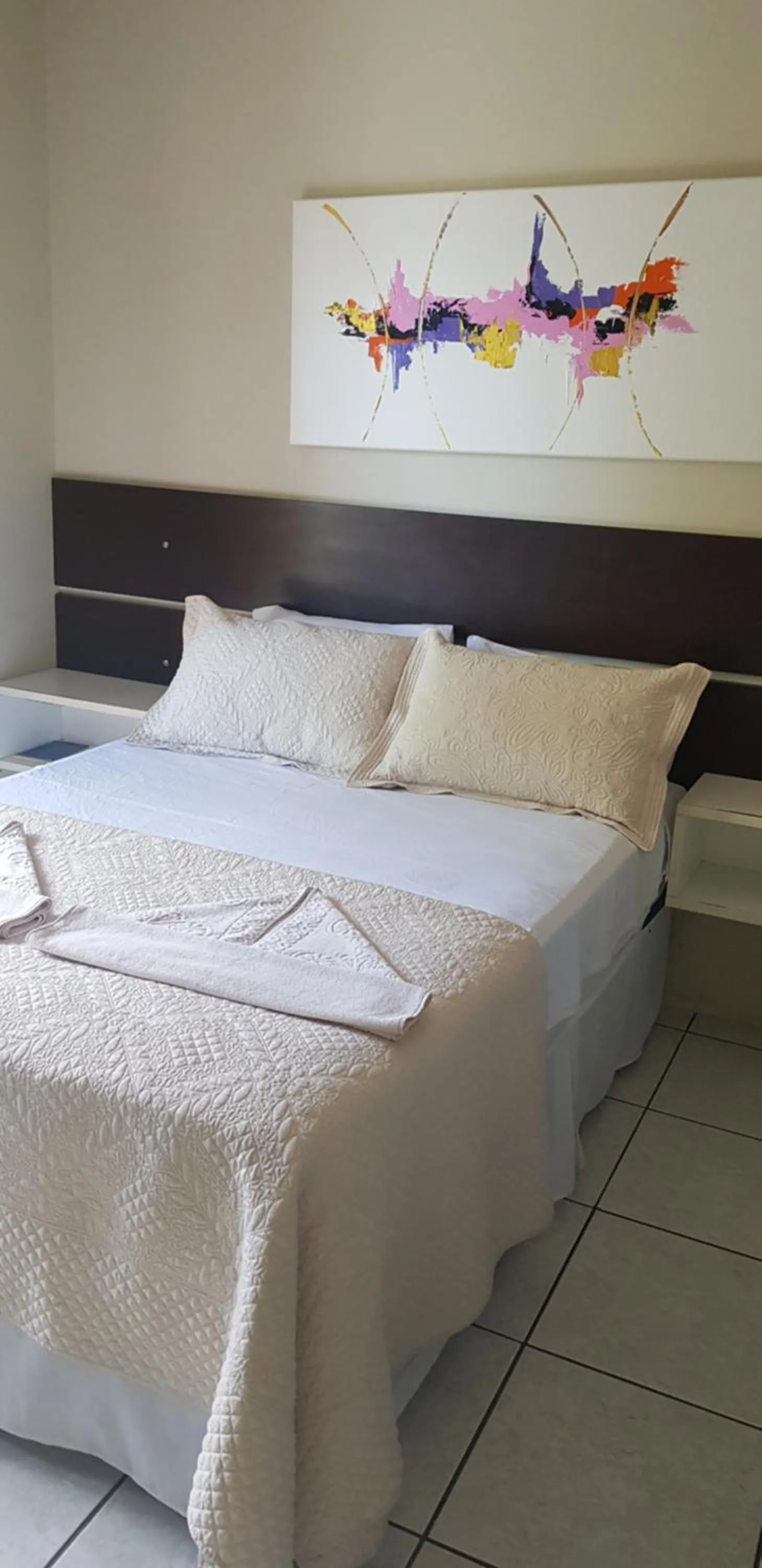 Bed in Pousada Guaruja