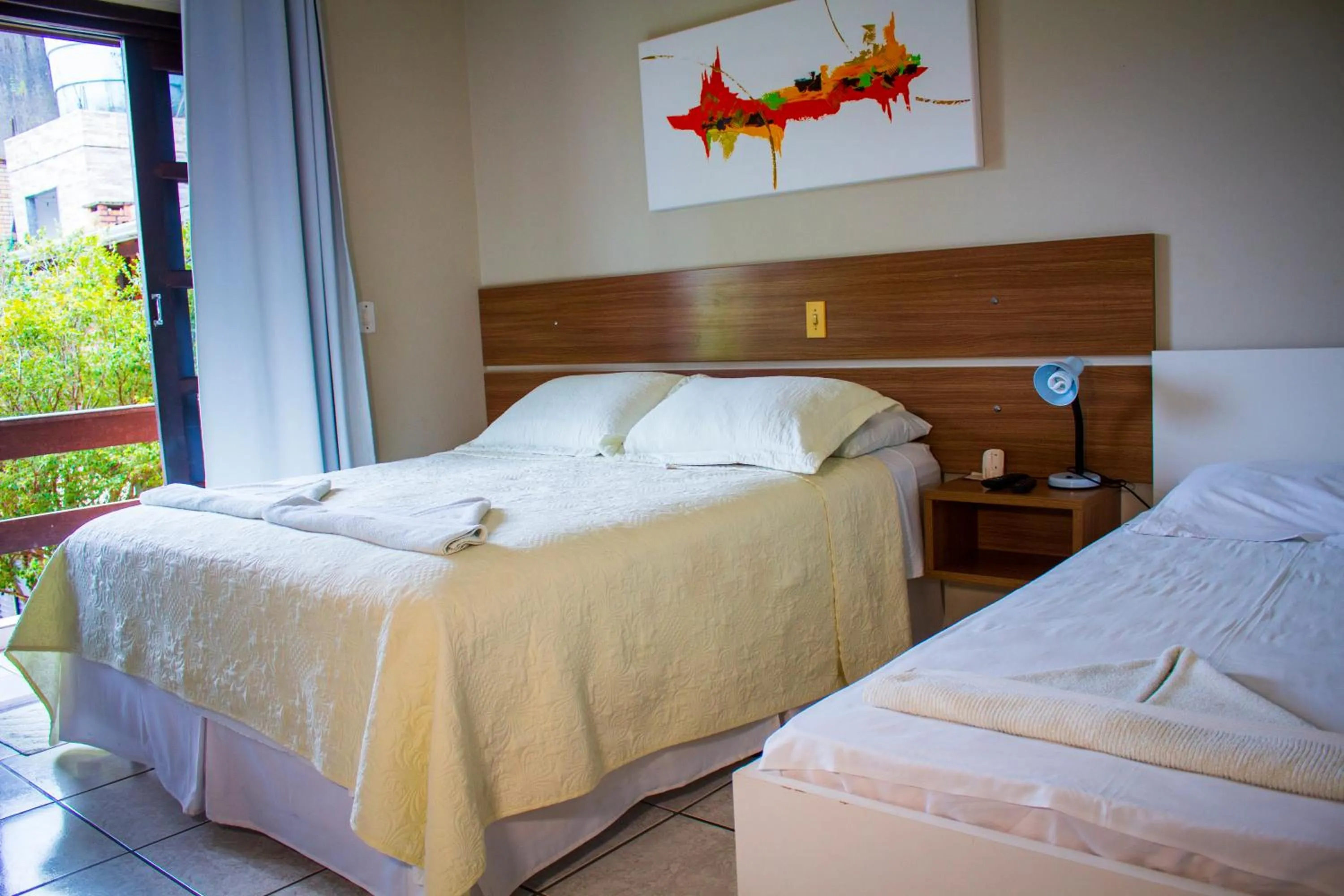 Bed in Pousada Guaruja