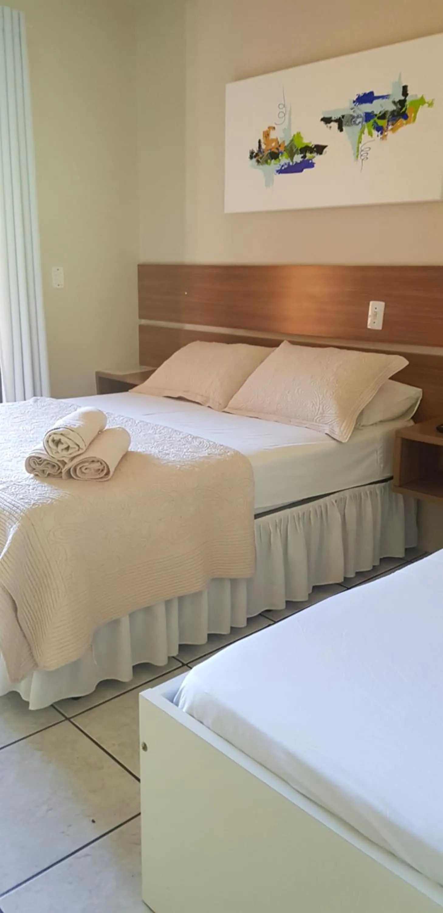 Bed in Pousada Guaruja