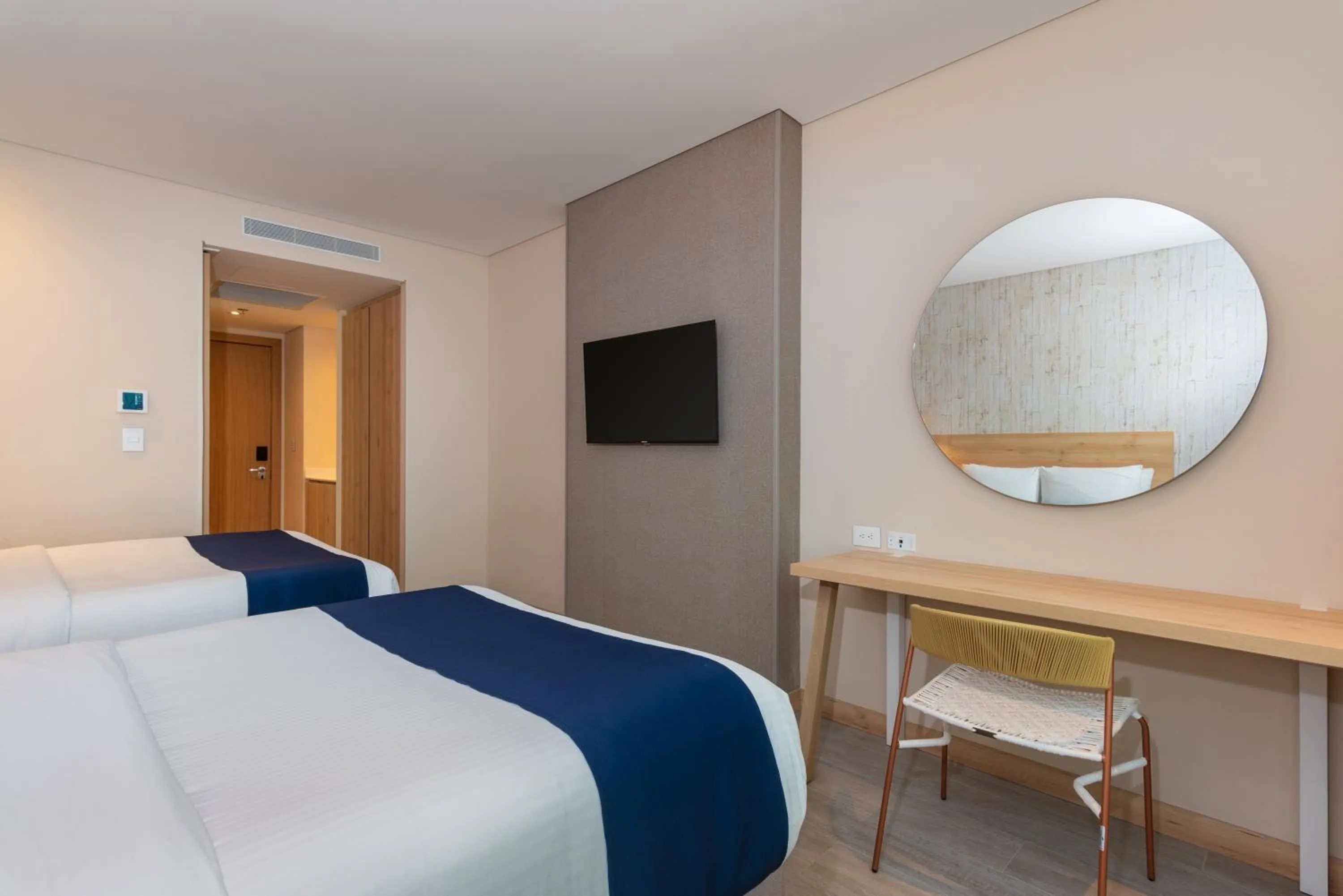 Communal lounge/ TV room, Bed in Aquamare Hotel