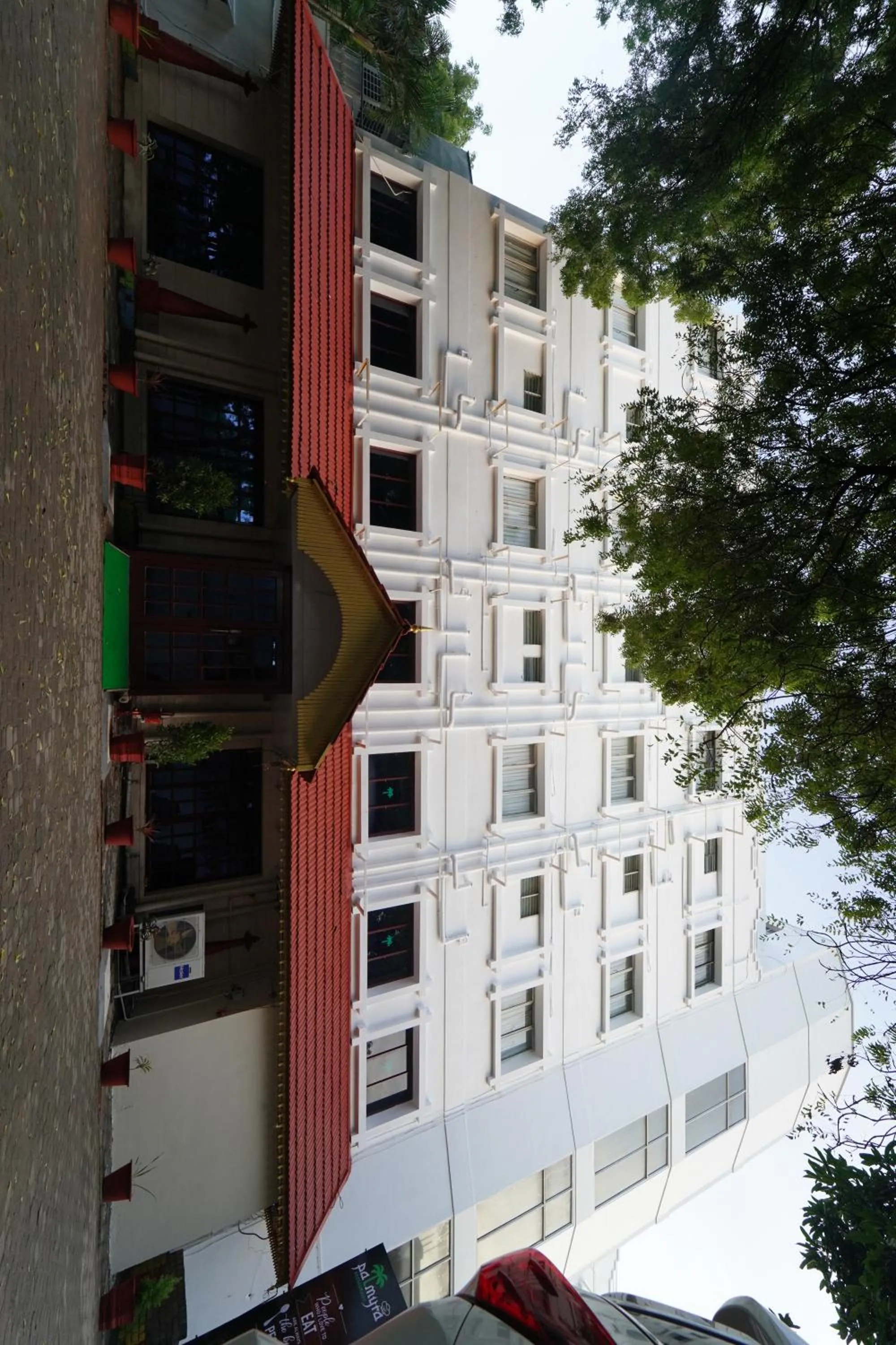 Property building in Hotel Palmyra Grand Inn