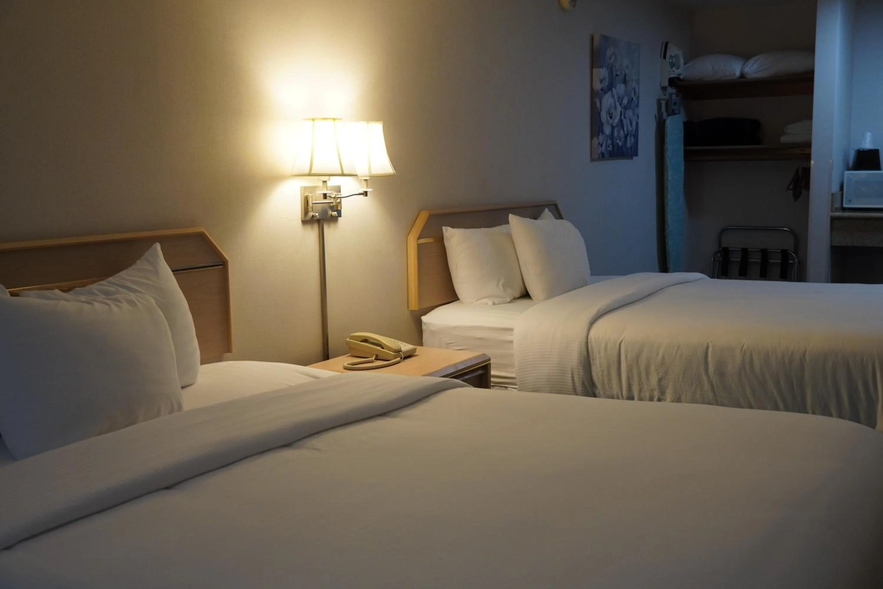 Bed in Timberland Inn & Suites